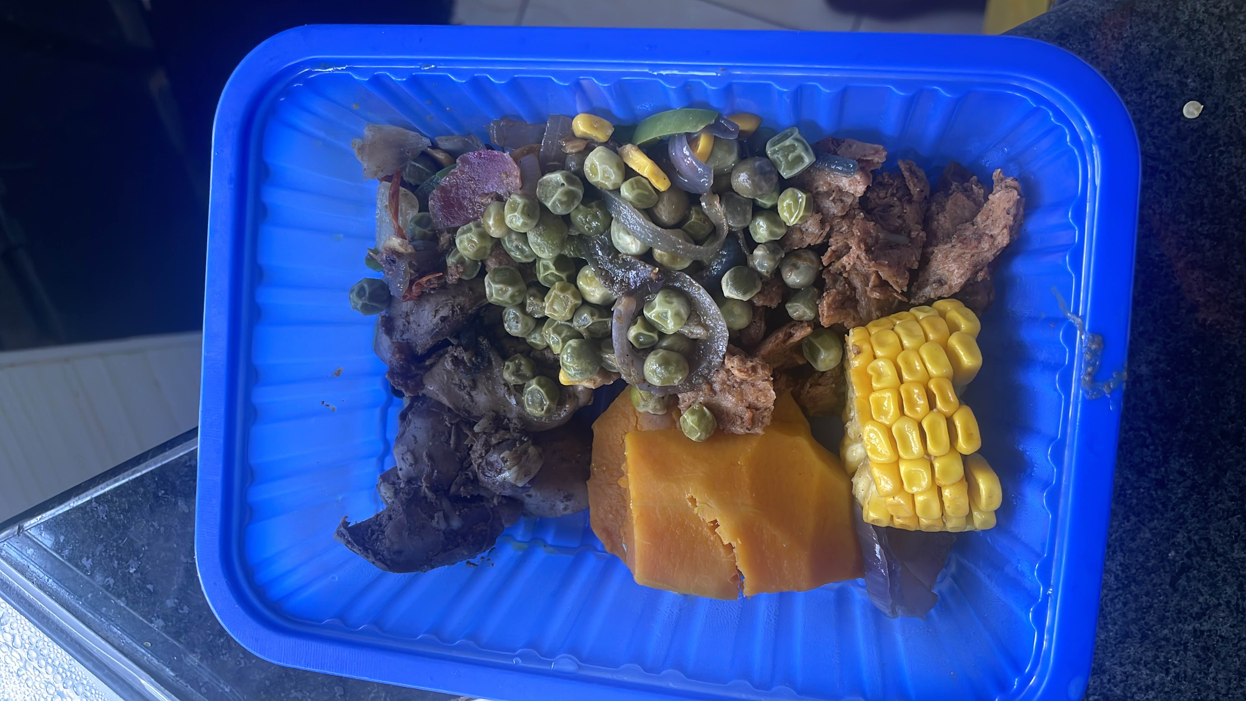 A balanced meal containing protein-rich chicken liver and beef, fiber-packed green peas and corn, and nutrient-dense pumpkin and onions.