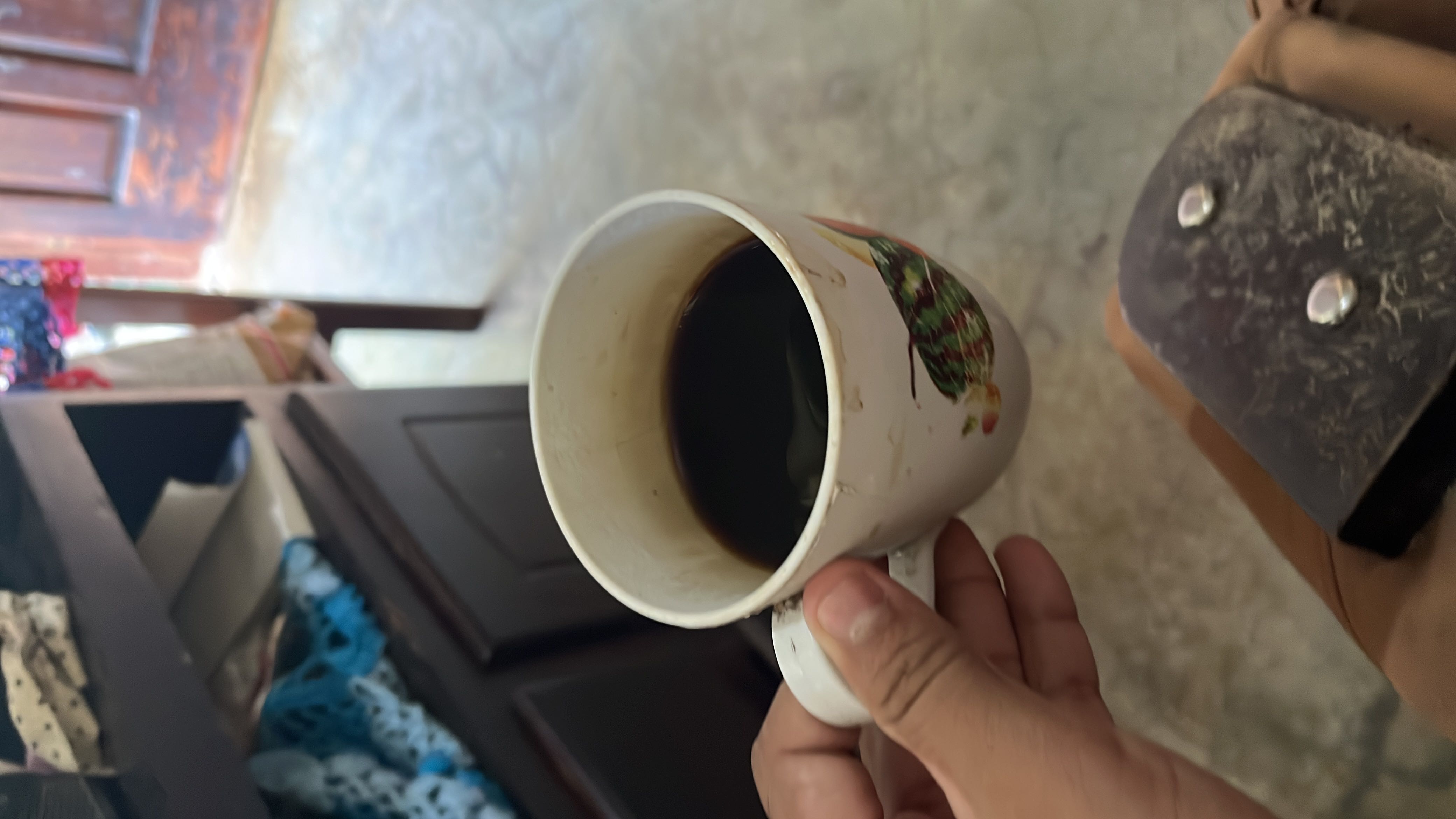A cup of black coffee with minimal calories, no fats, and no carbohydrates, making it a healthy beverage choice.