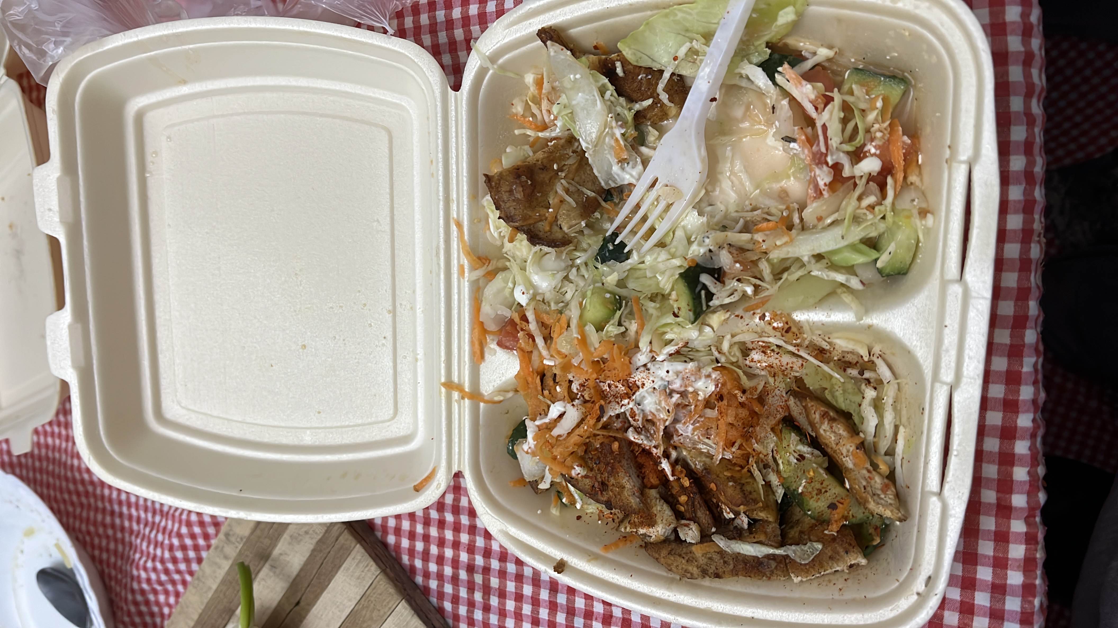 A balanced meal with grilled meat, fresh vegetables, and a creamy dressing.