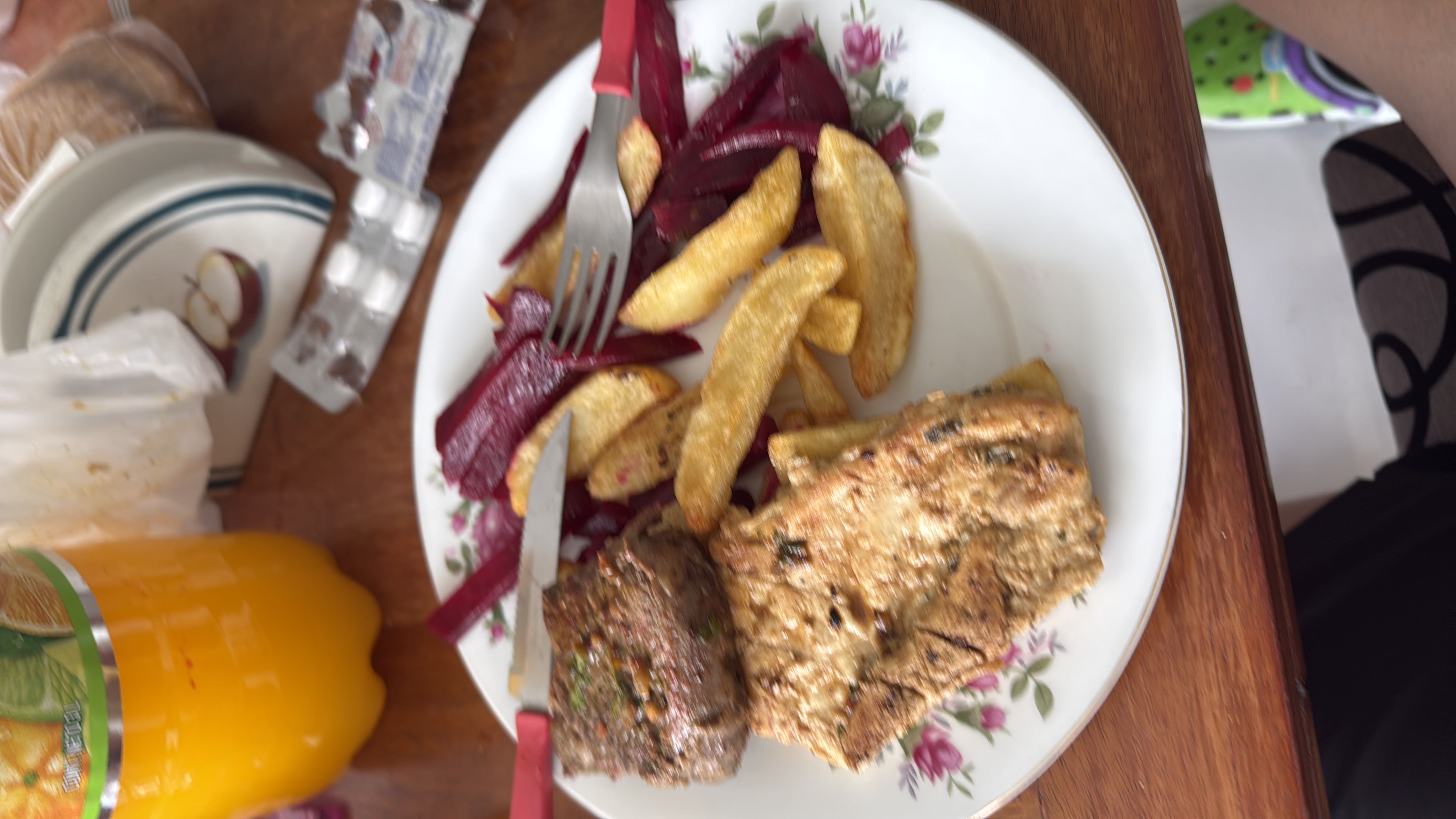 A balanced meal consisting of grilled beef, an omelette, French fries, and beetroot, providing a mix of protein, carbohydrates, and fats.