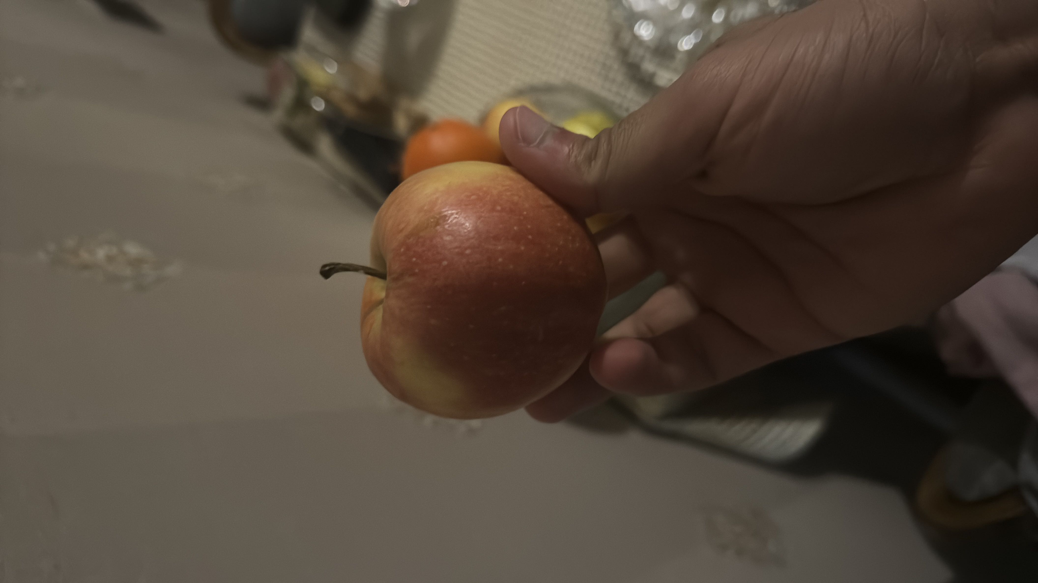 A fresh apple, which is a nutritious fruit rich in fiber and vitamins, providing a healthy snack option.