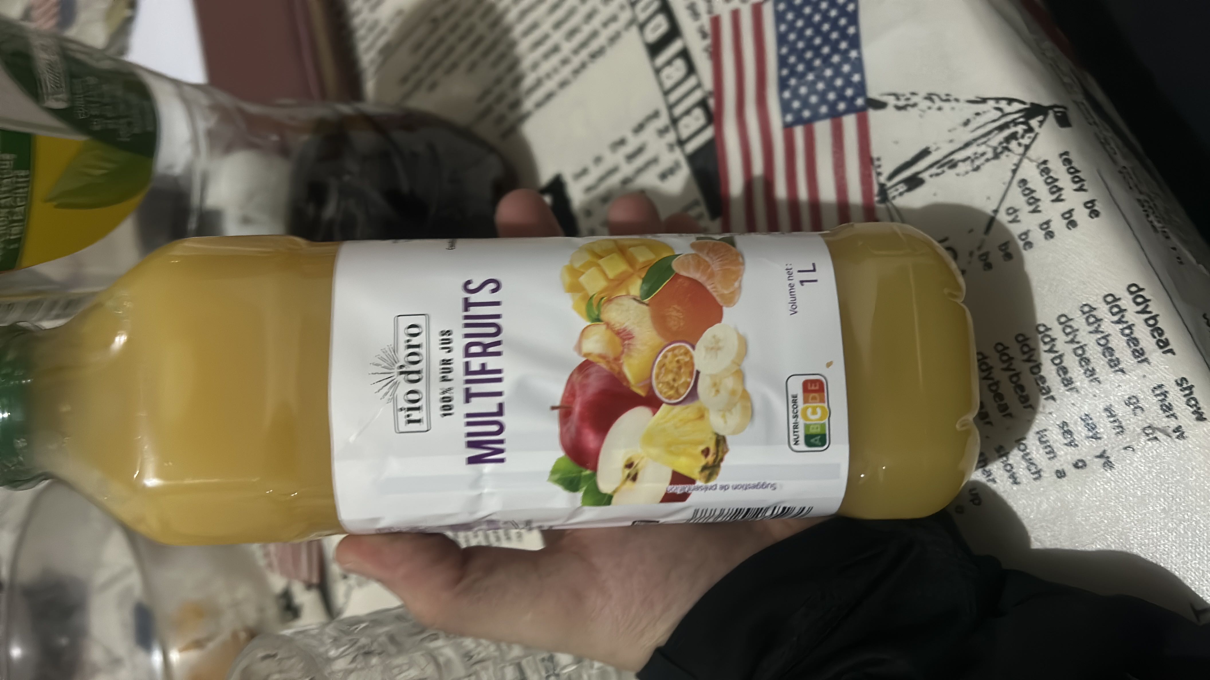 A 100% pure multifruit juice containing a blend of apple, mango, banana, and pineapple, providing a natural source of carbohydrates and vitamins.