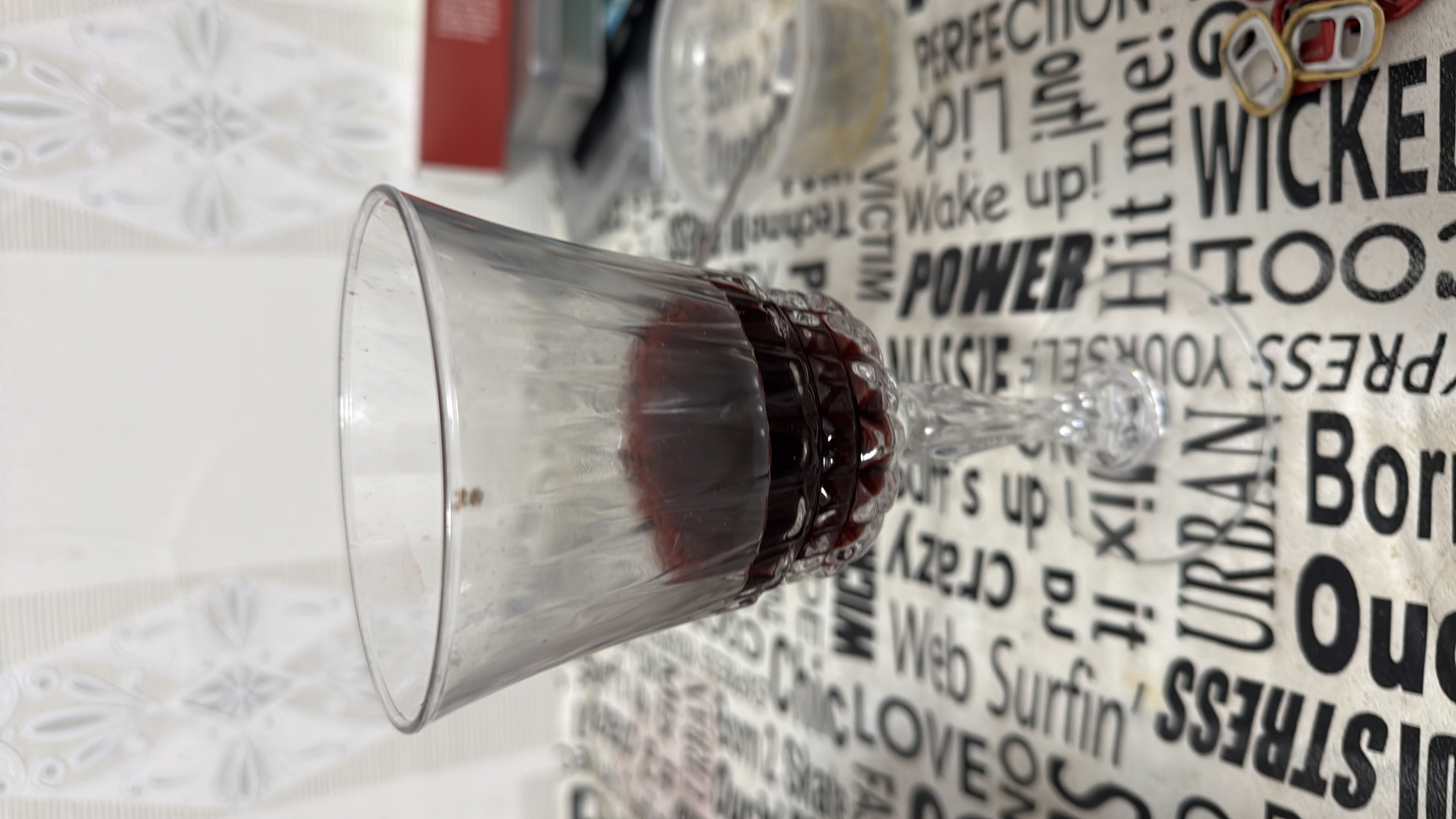 A glass of red wine with moderate calorie content, primarily consisting of carbohydrates.