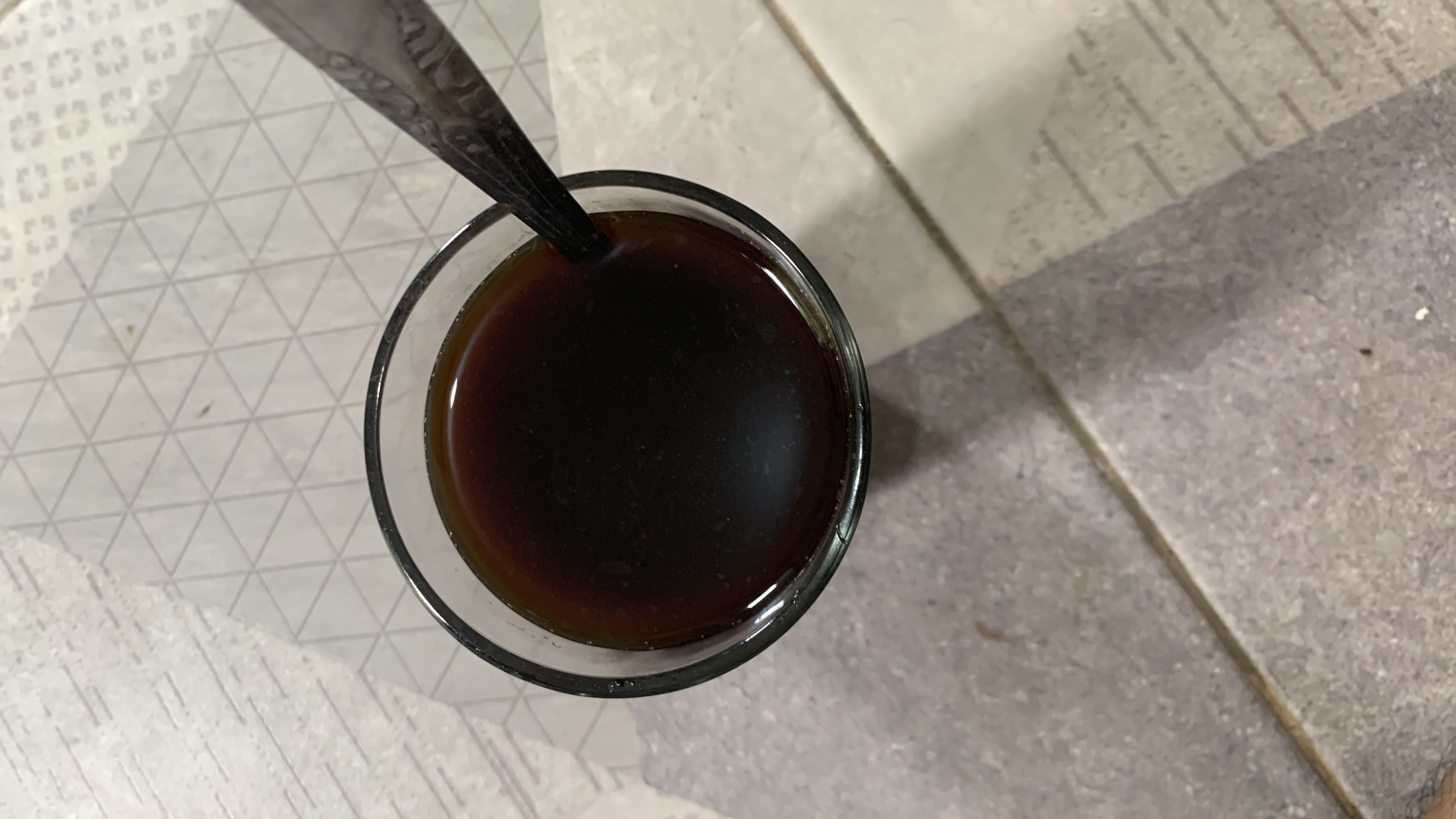 A cup of black coffee, a low-calorie beverage with minimal macronutrients, known for its rich antioxidants and metabolism-boosting properties.