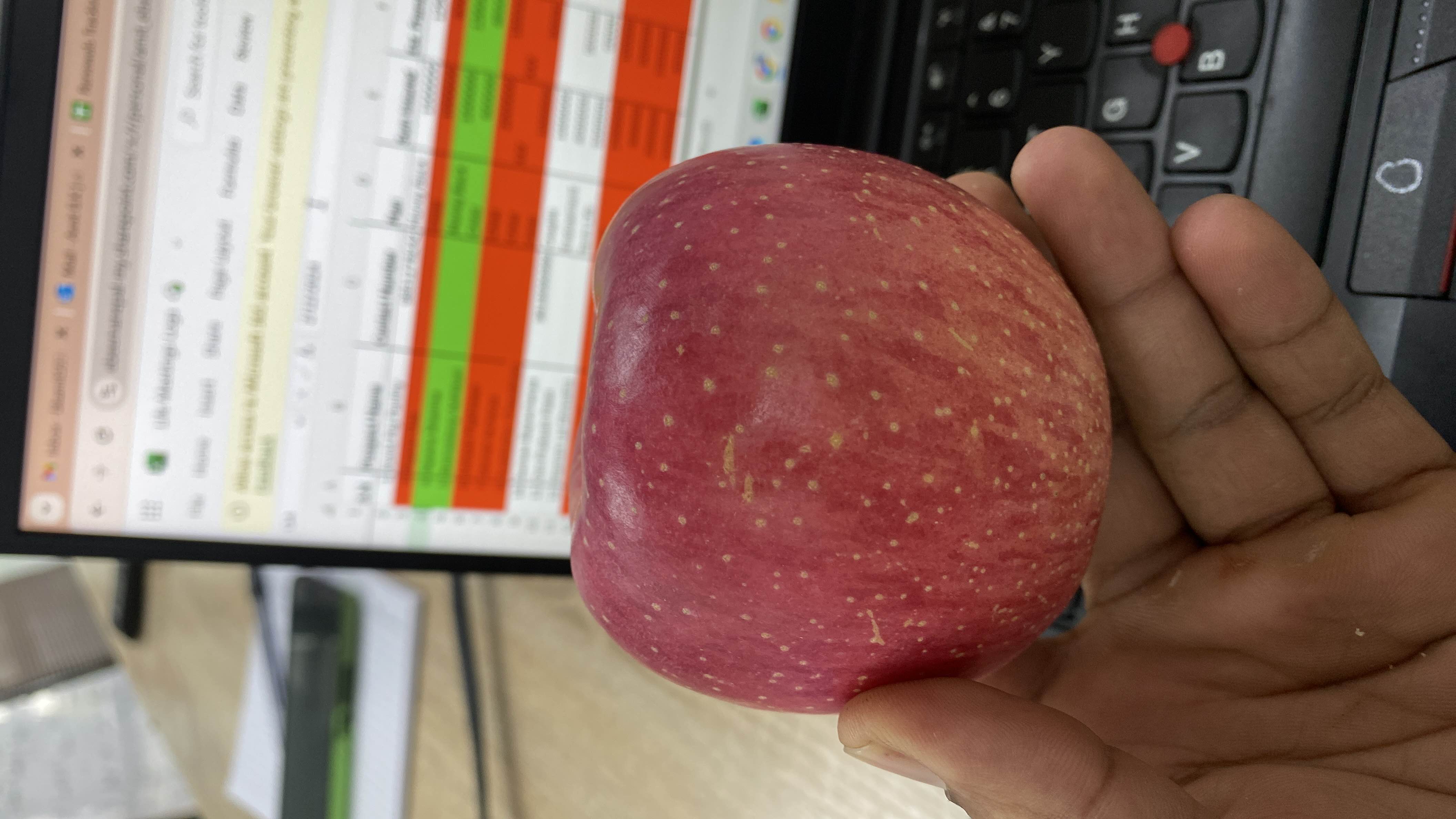 A fresh red apple, which is a nutritious fruit rich in fiber and vitamins, commonly consumed as a healthy snack.
