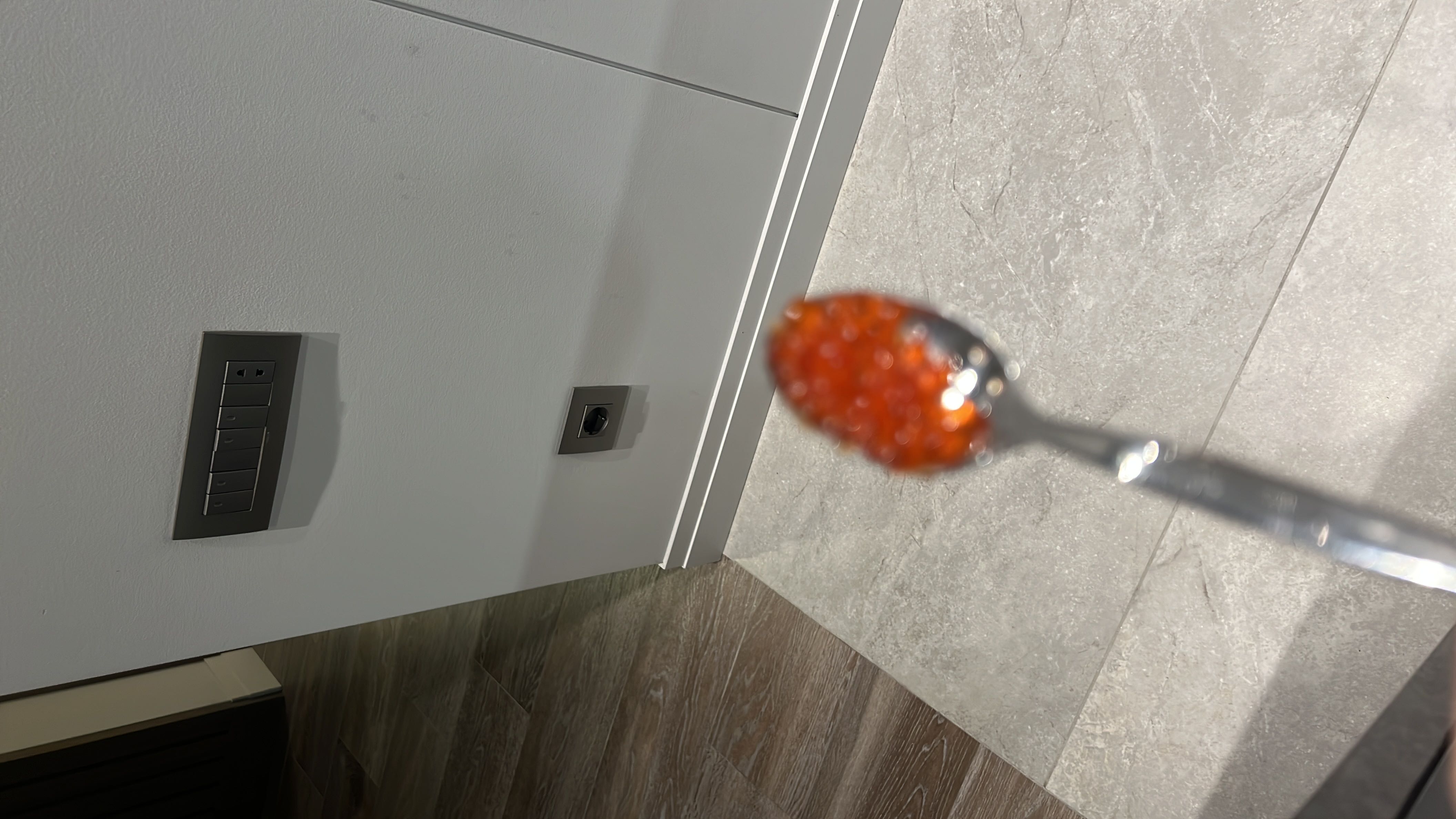 A spoonful of salmon roe, a nutrient-dense seafood delicacy rich in protein and healthy fats.