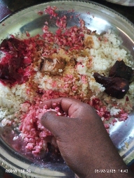 A traditional meal consisting of rice, beetroot, and meat, served with spices. The dish is rich in carbohydrates and proteins, offering a balanced nutritional profile.