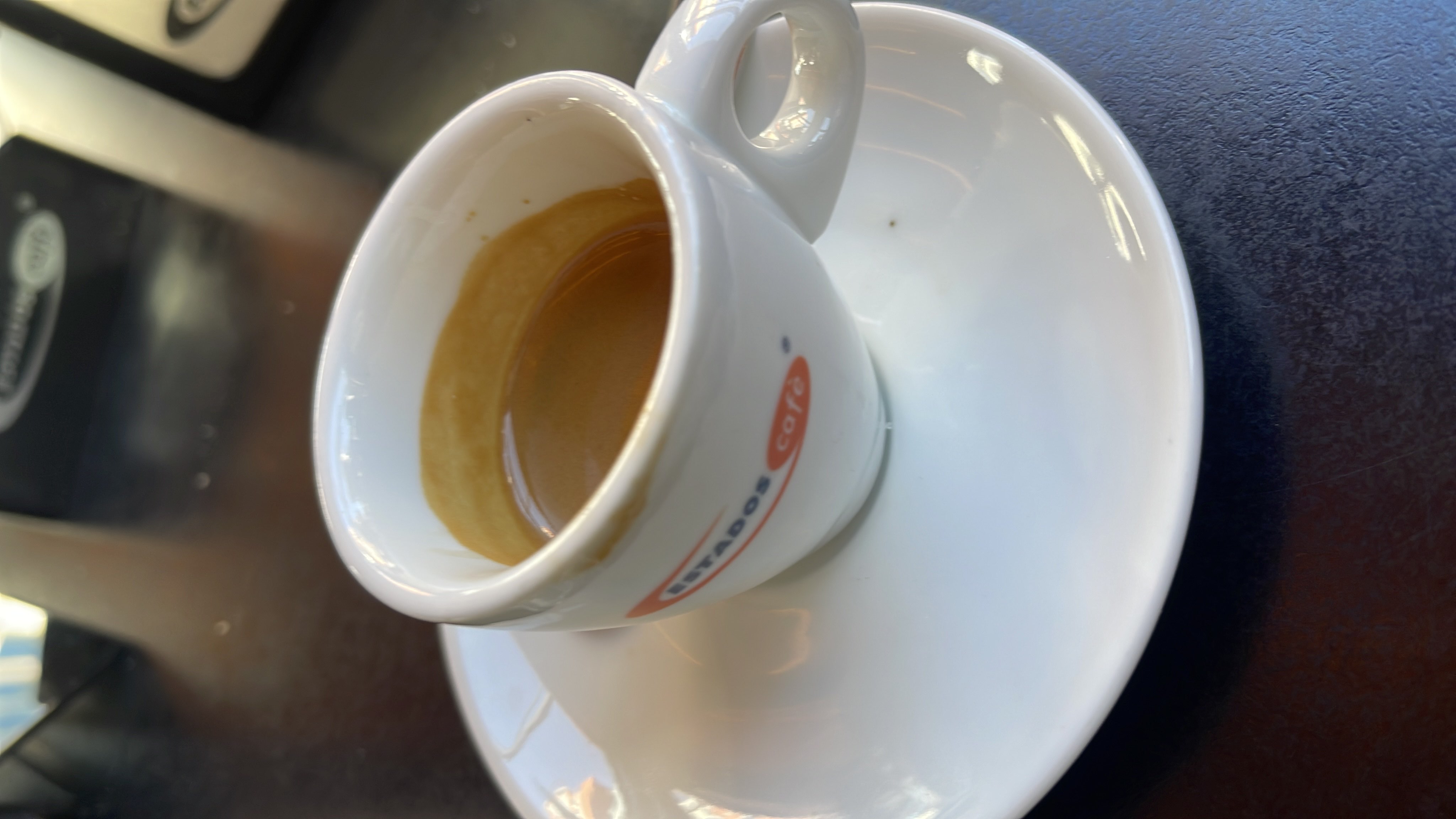 A cup of espresso, a low-calorie coffee beverage with minimal macronutrients, known for its strong flavor and high caffeine content.