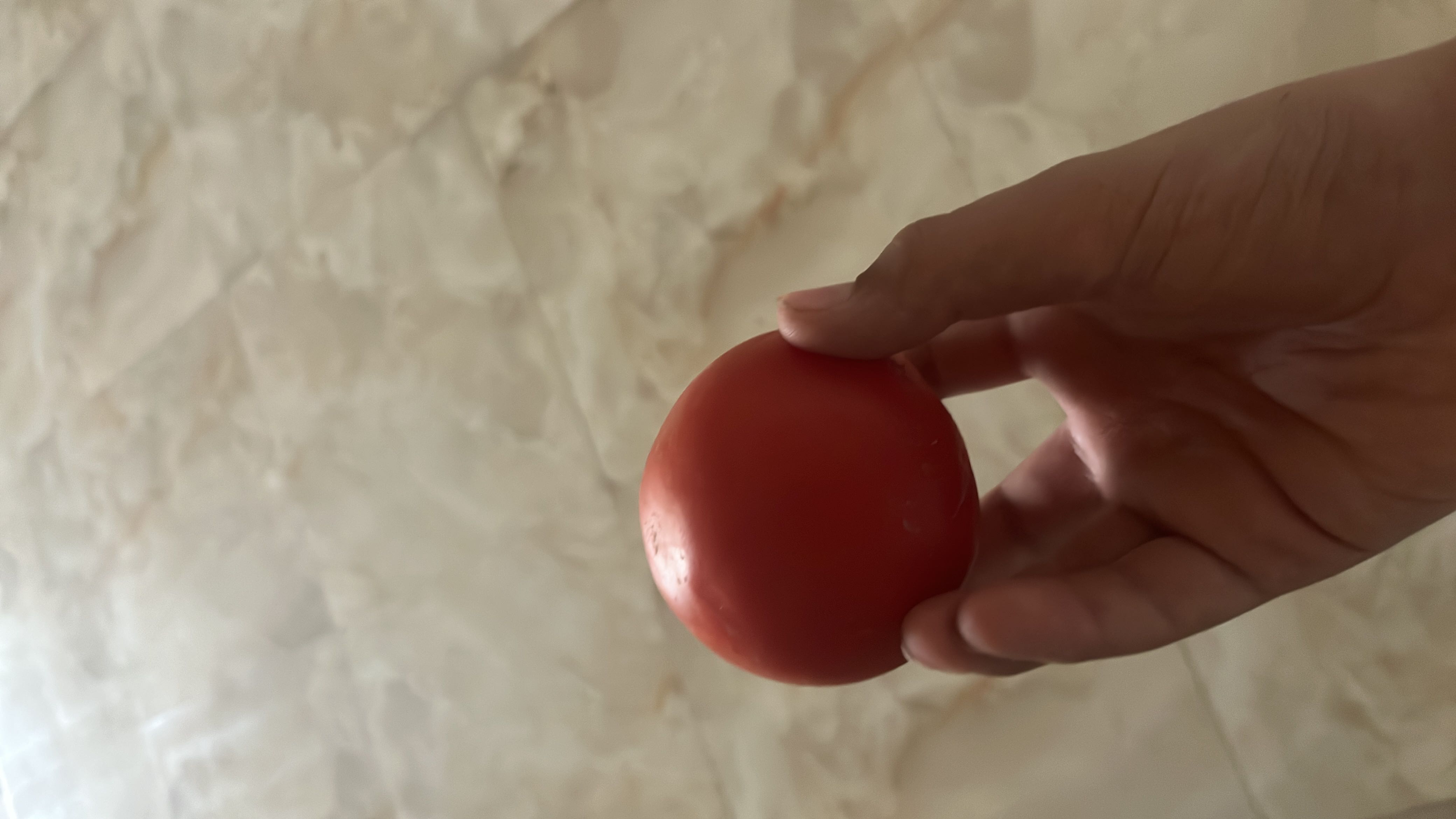 A fresh tomato, low in calories and rich in vitamins, making it a healthy choice.