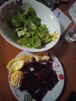 A healthy meal consisting of fresh lettuce, boiled beetroot, and orange slices, providing a balanced intake of vitamins, fiber, and natural sugars.