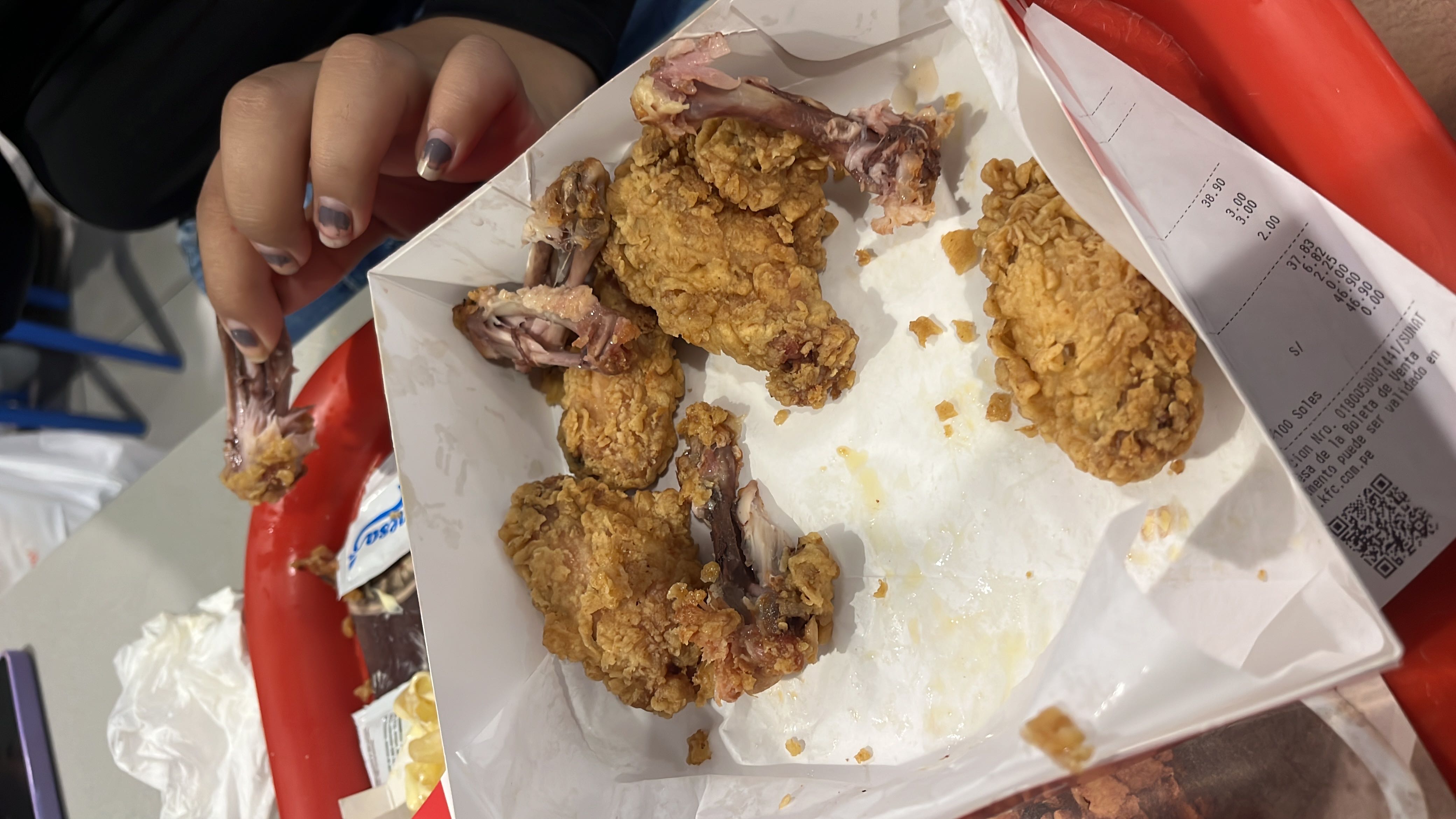A serving of fried chicken with a crispy coating, high in protein and fats, but also containing a significant amount of carbohydrates.