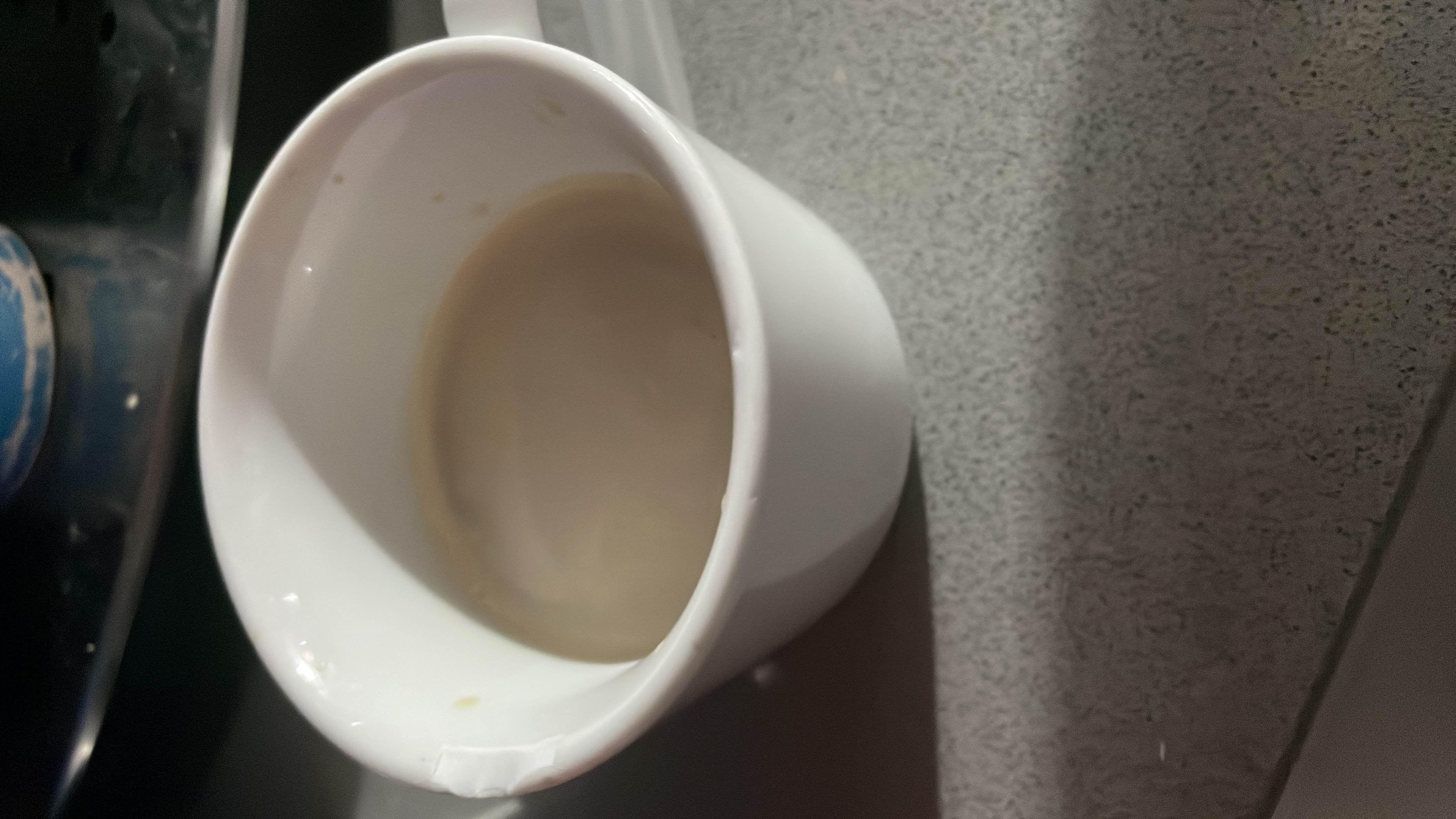 A cup of coffee with 20ml milk, containing 36 calories with a balance of protein, carbs, and fats.