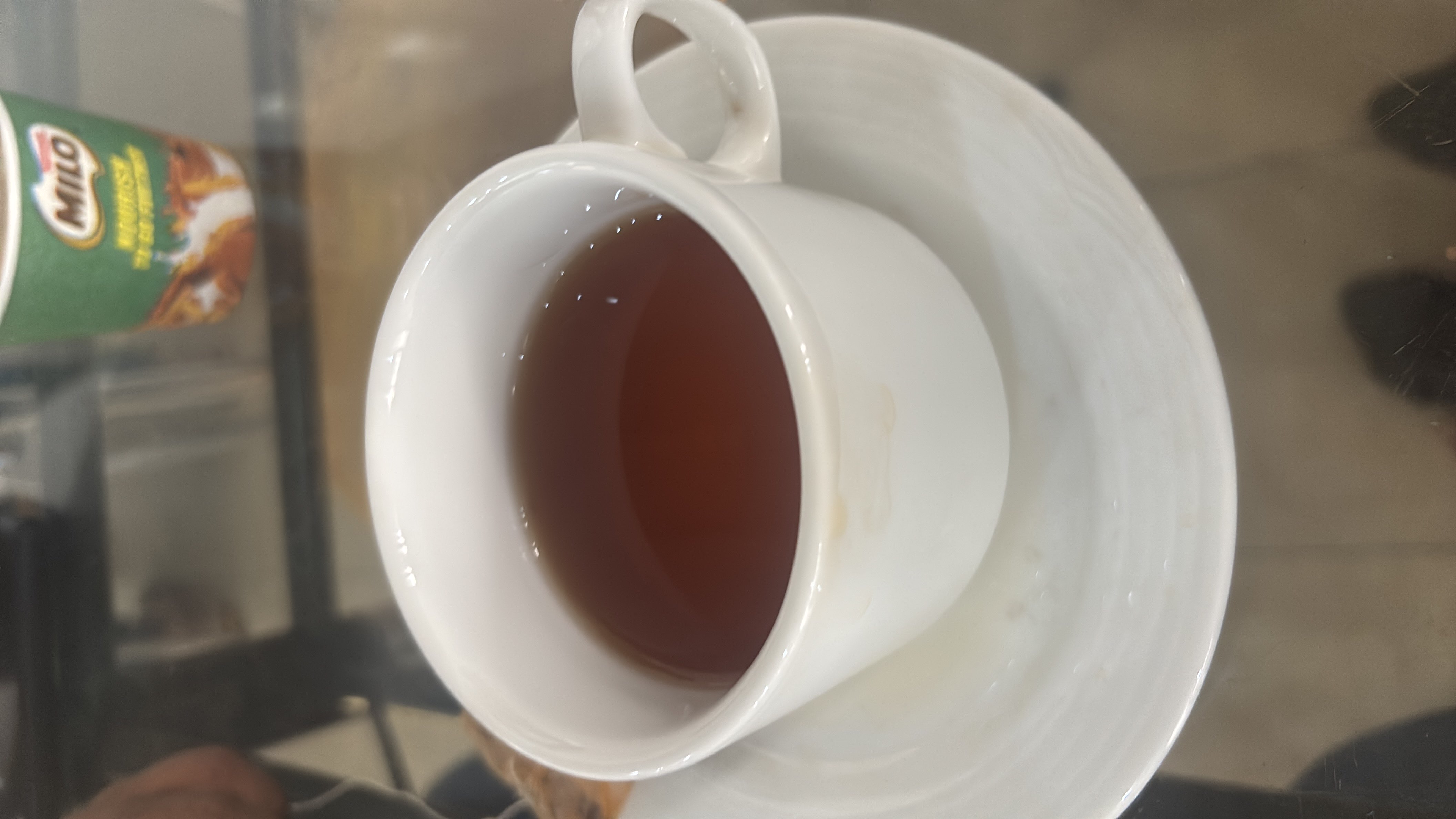 A cup of plain black tea, which is low in calories and contains no fats or carbohydrates.