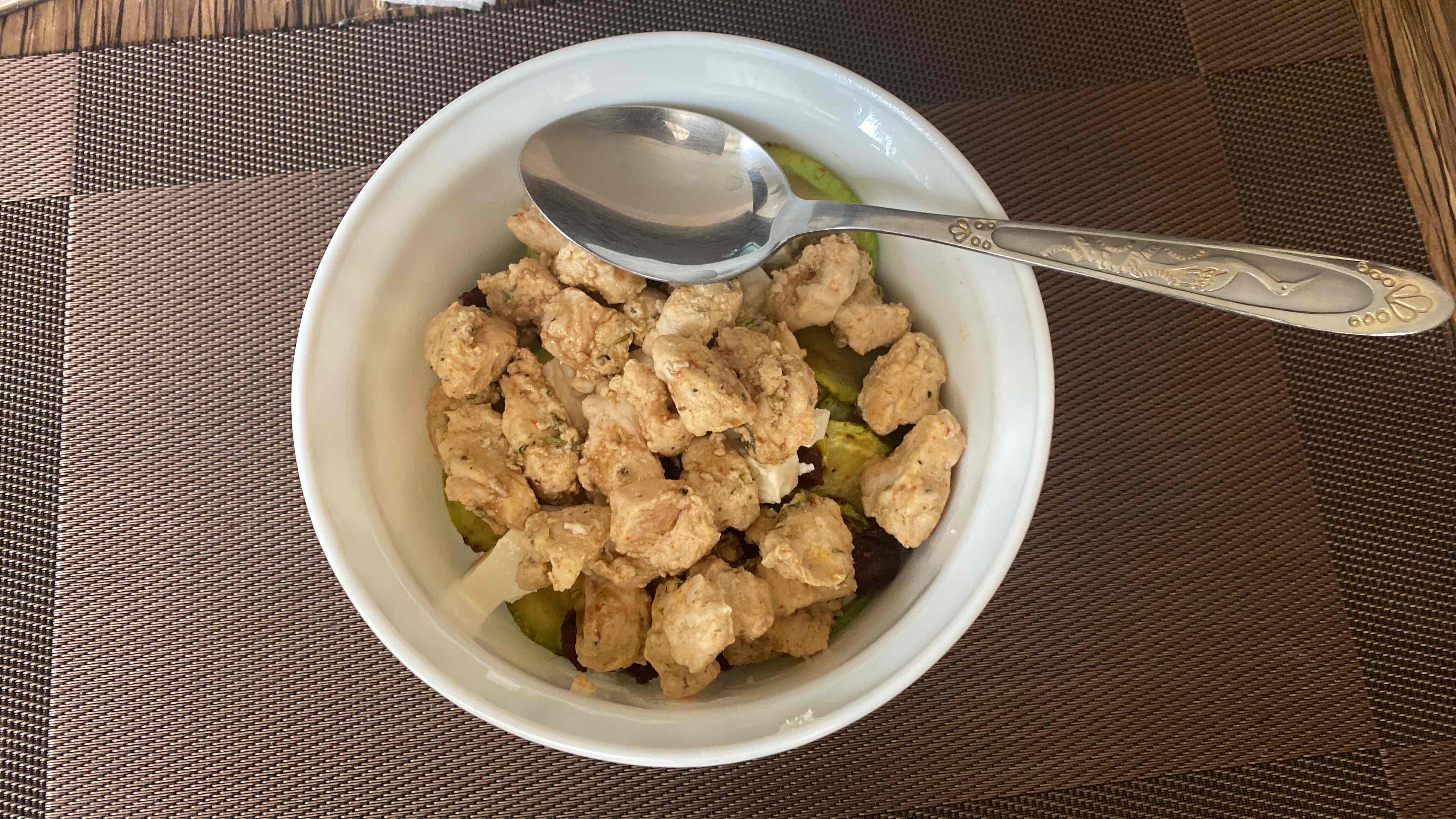 A nutritious bowl featuring chicken, lentils, pumpkin, feta cheese, blueberries, apple cider vinegar, and pomegranate sauce, providing a balanced mix of protein, carbohydrates, and healthy fats.
