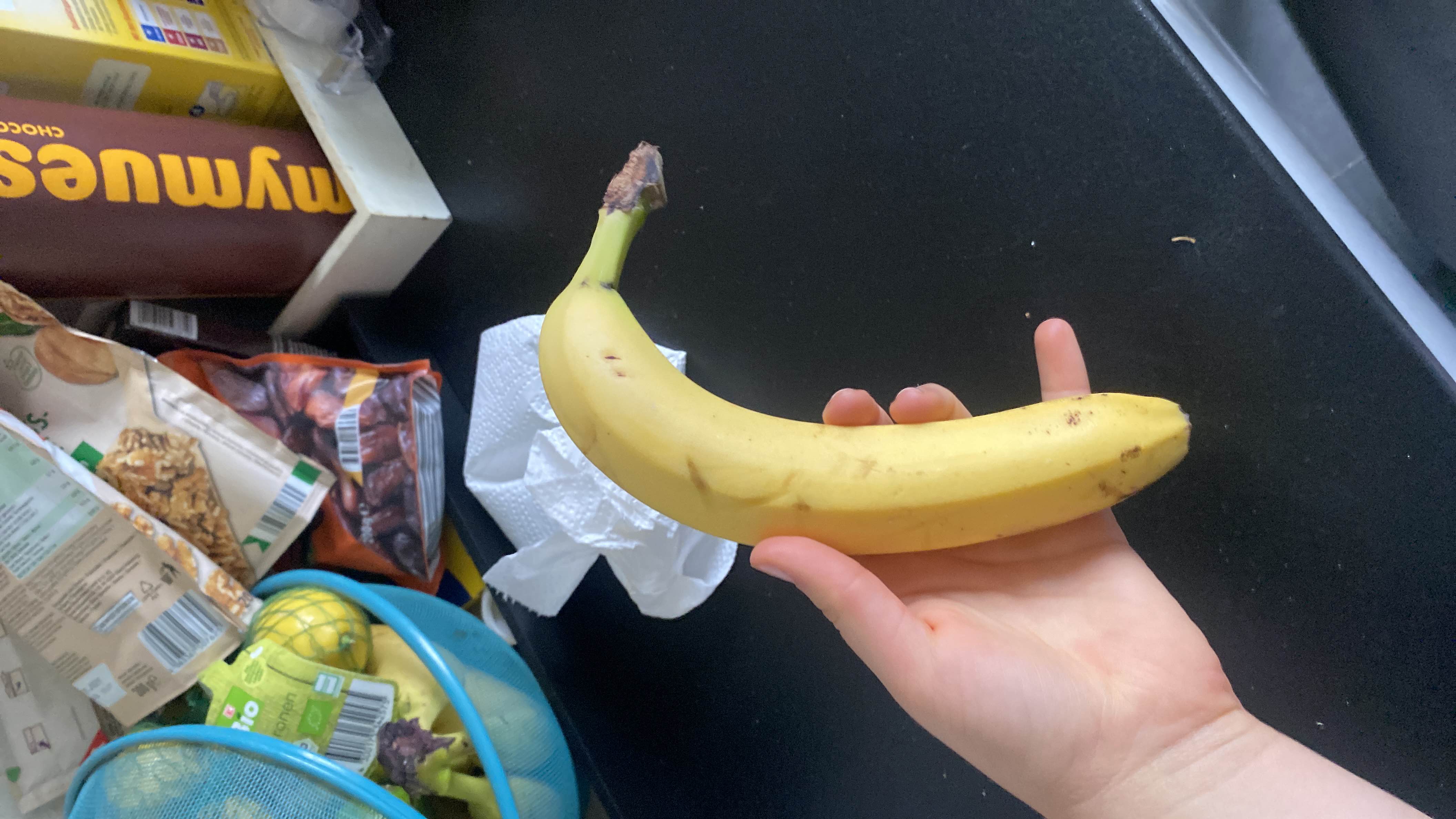 A ripe banana, a nutritious fruit rich in carbohydrates and essential vitamins, providing a quick energy boost.