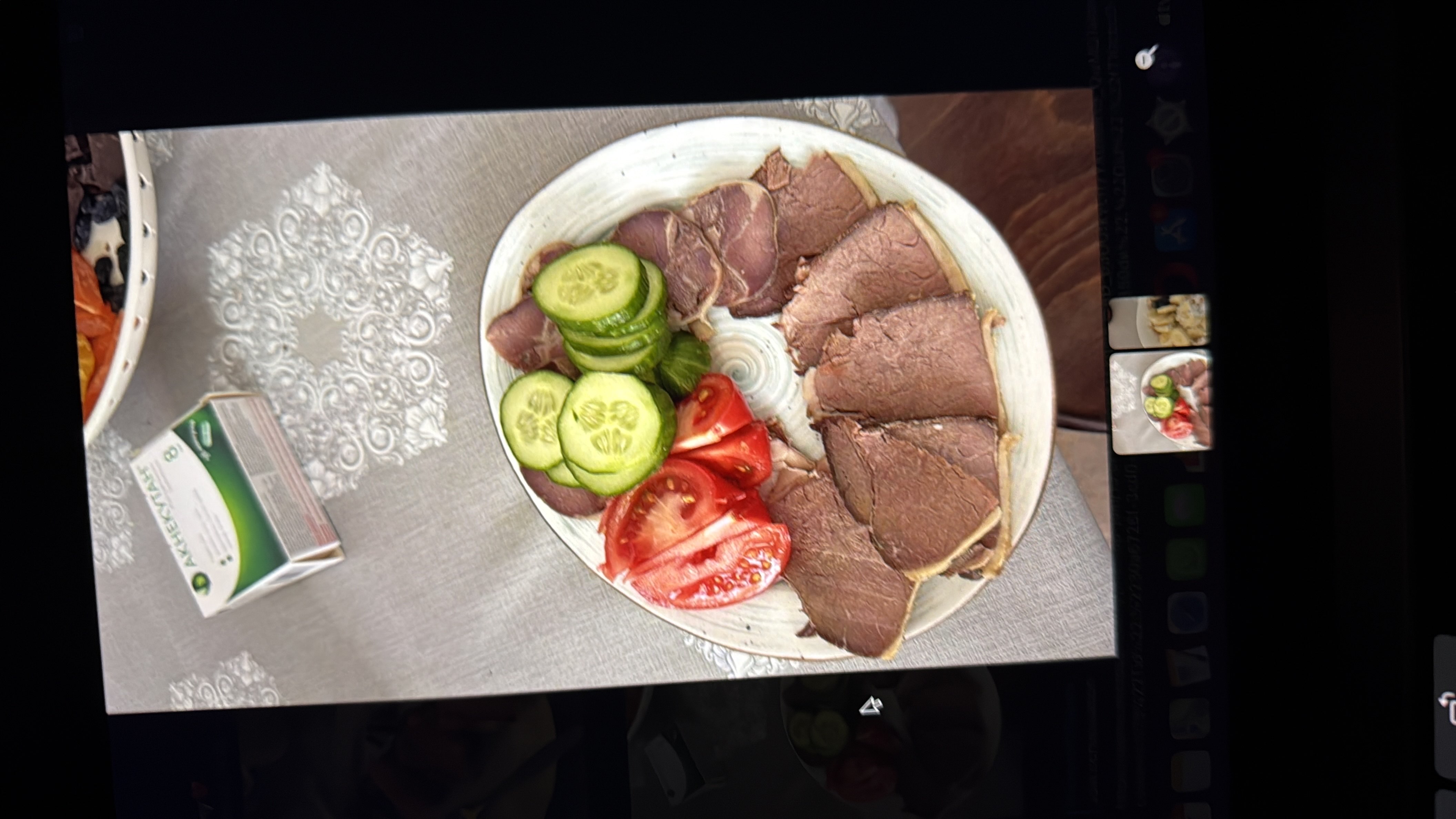 A plate containing sliced beef, fresh cucumbers, and tomatoes, providing a balanced mix of protein, fiber, and essential nutrients.