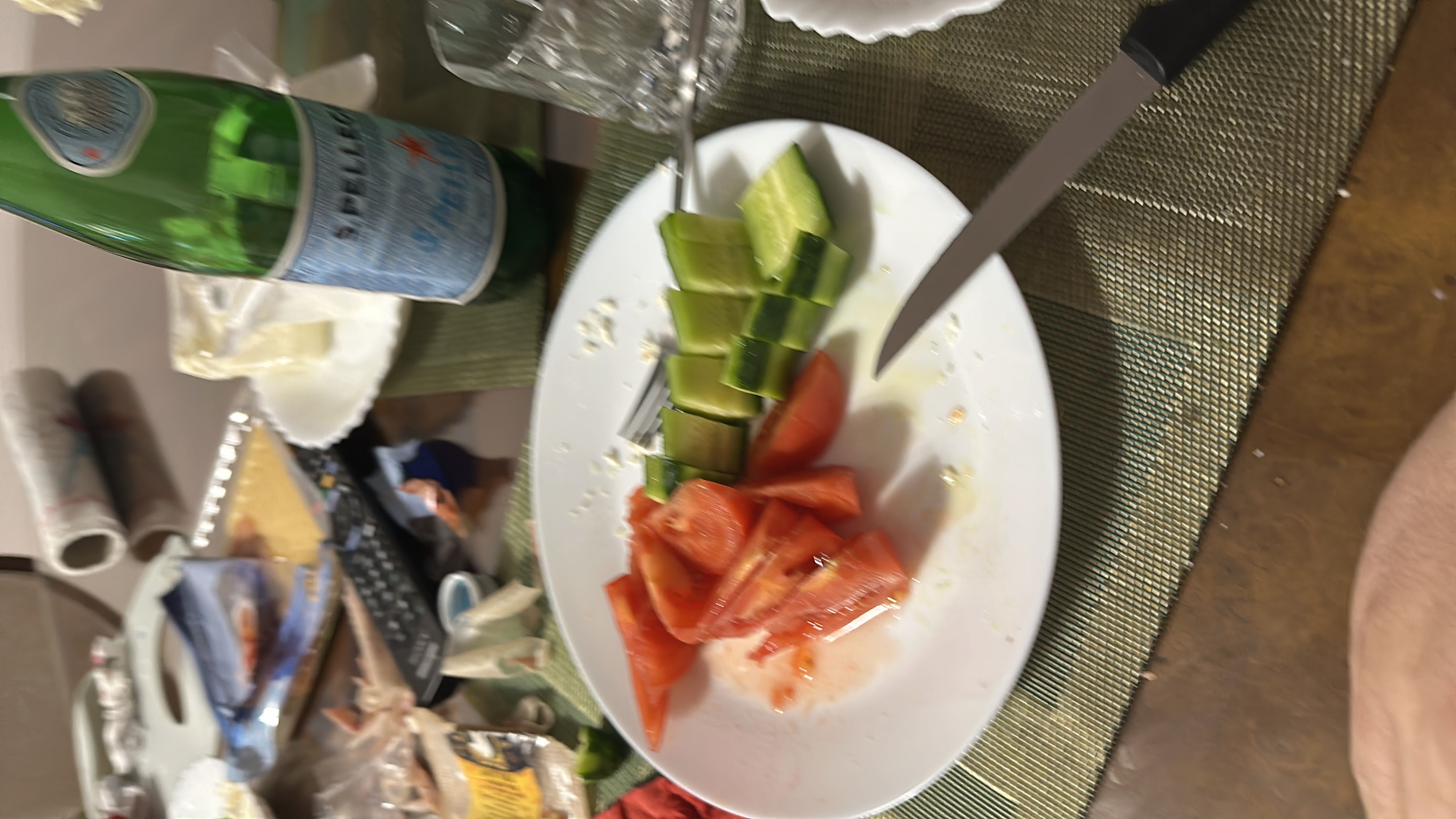 A simple and healthy plate containing sliced tomatoes and cucumbers, providing a low-calorie, nutrient-rich meal.
