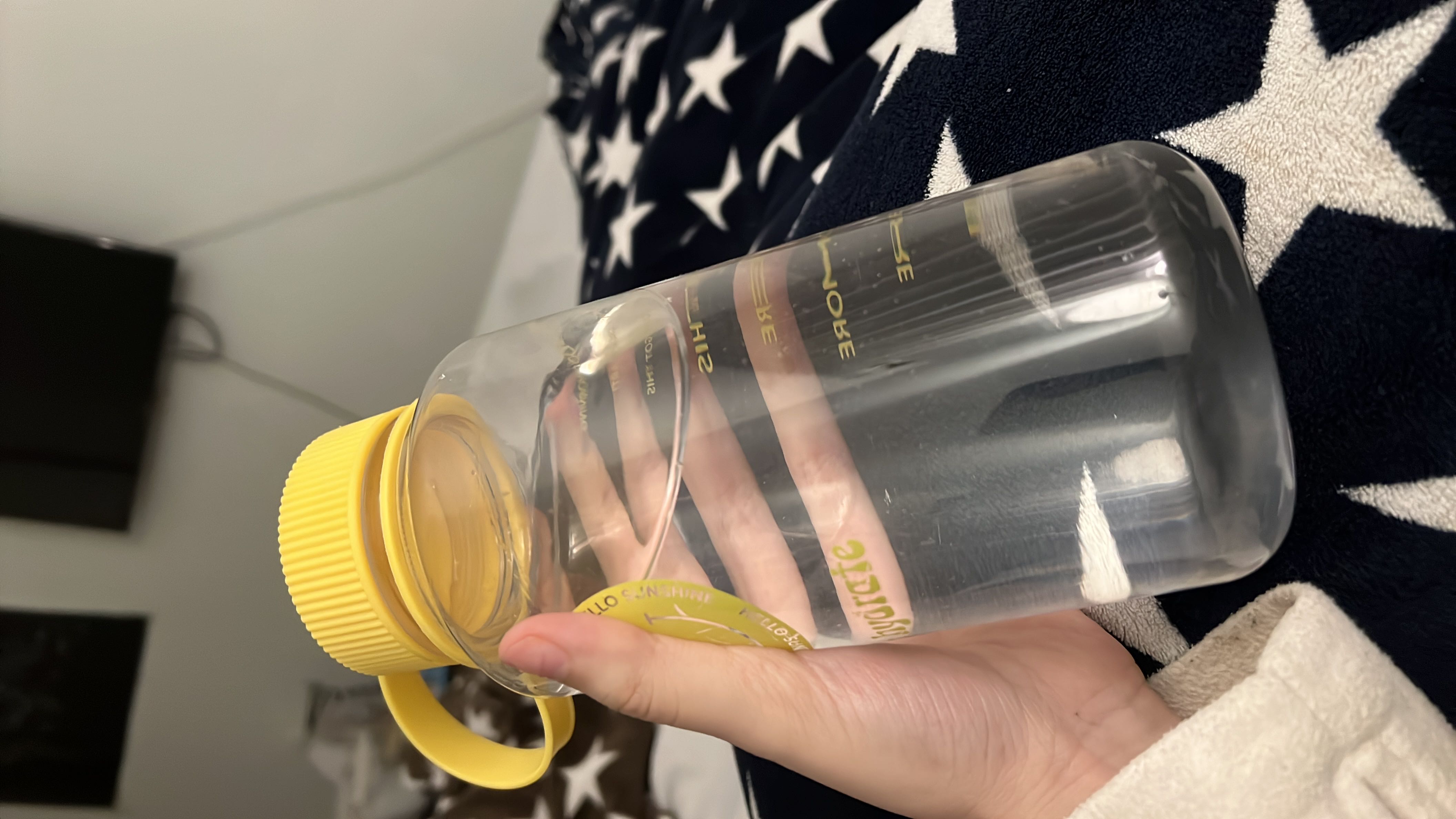 A bottle of water, which contains no calories, protein, carbs, or fats, and is essential for hydration.