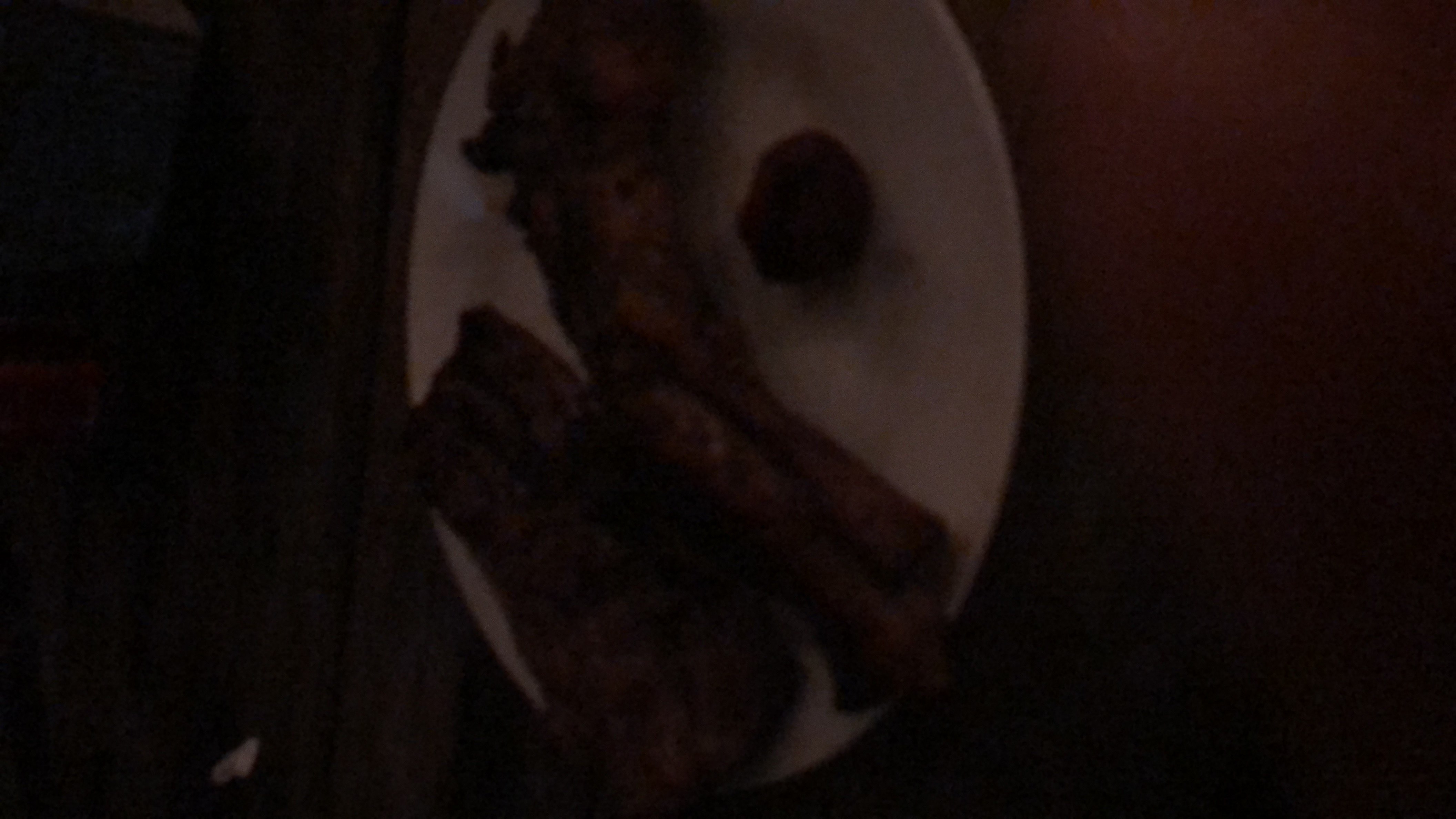 A plate of grilled meat with a side of sauce, providing a high-protein and high-fat meal.