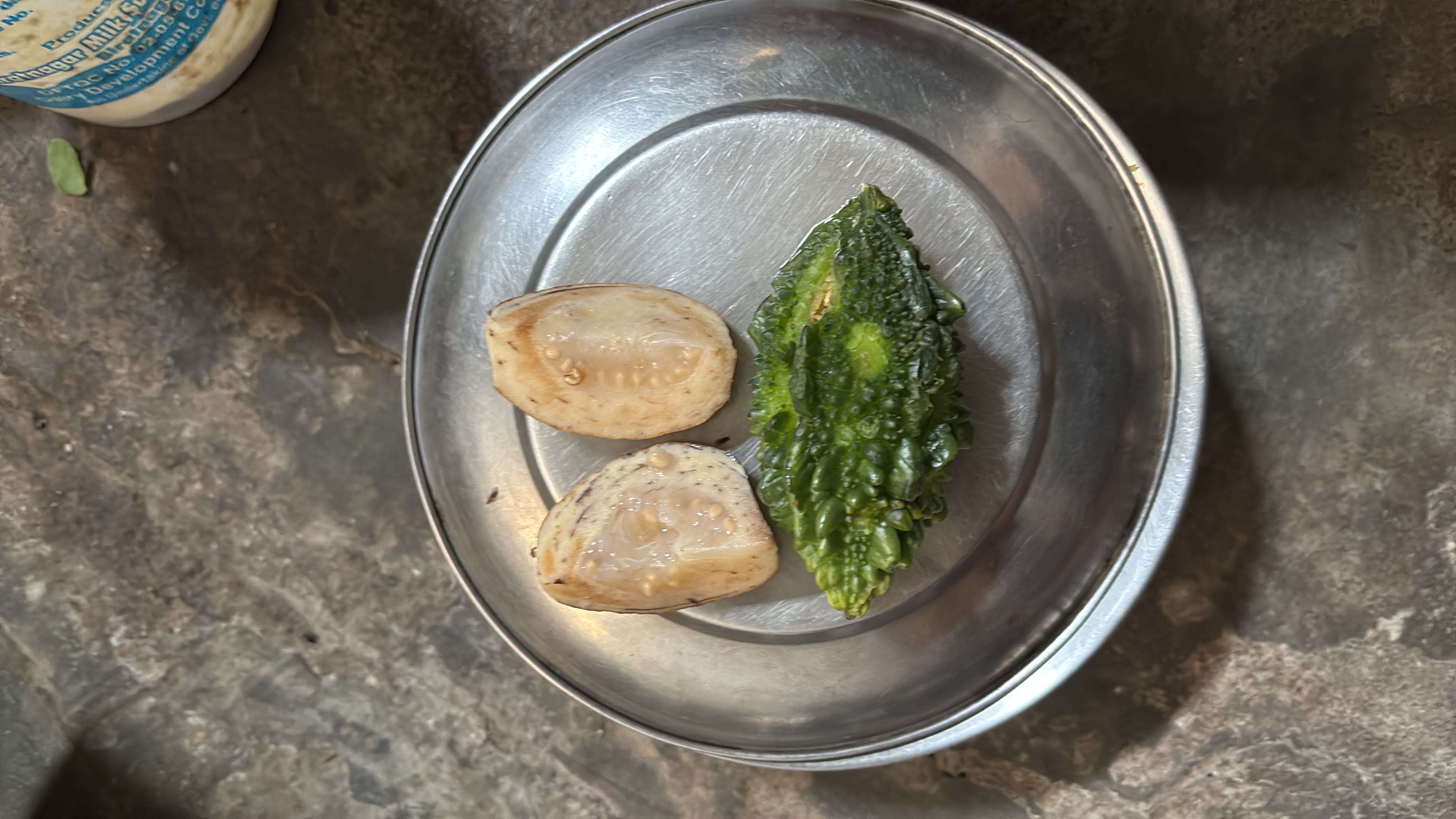 The image contains a small portion of bitter melon and eggplant, both of which are low in calories and rich in fiber, making them a healthy choice.