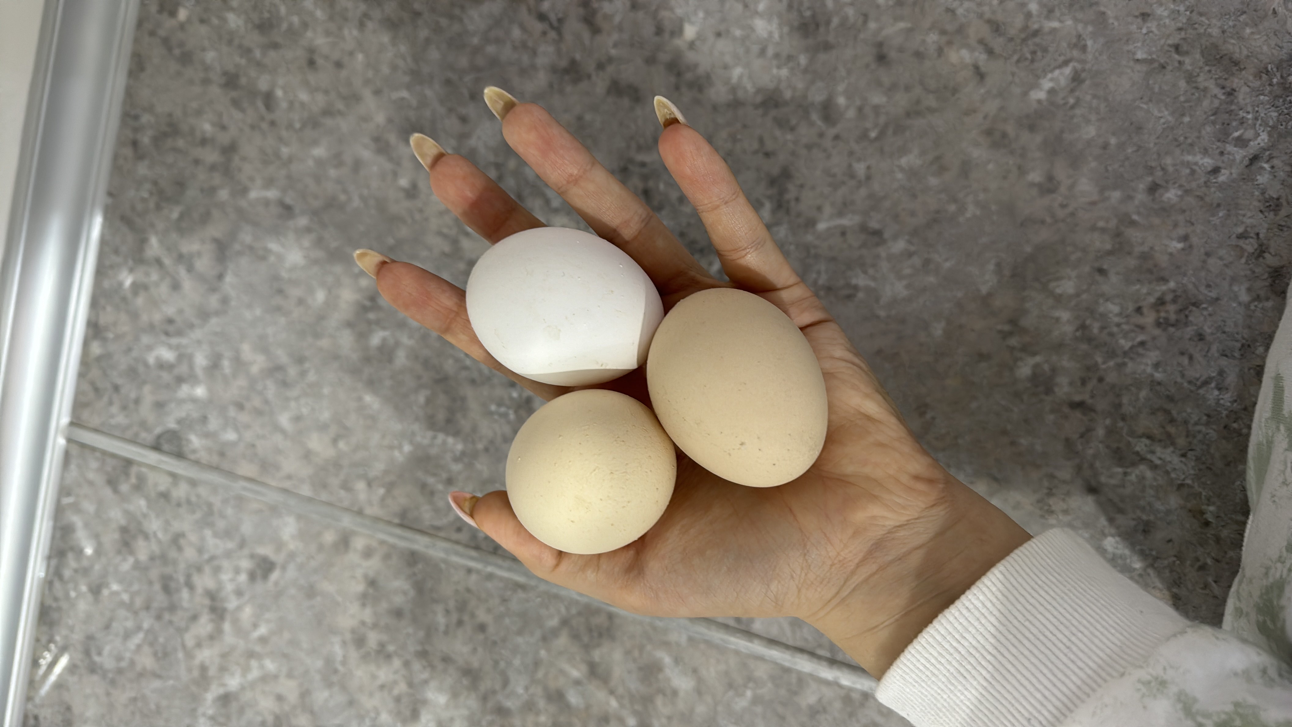 The image shows three eggs, which are a rich source of protein and healthy fats, making them a nutritious food choice.