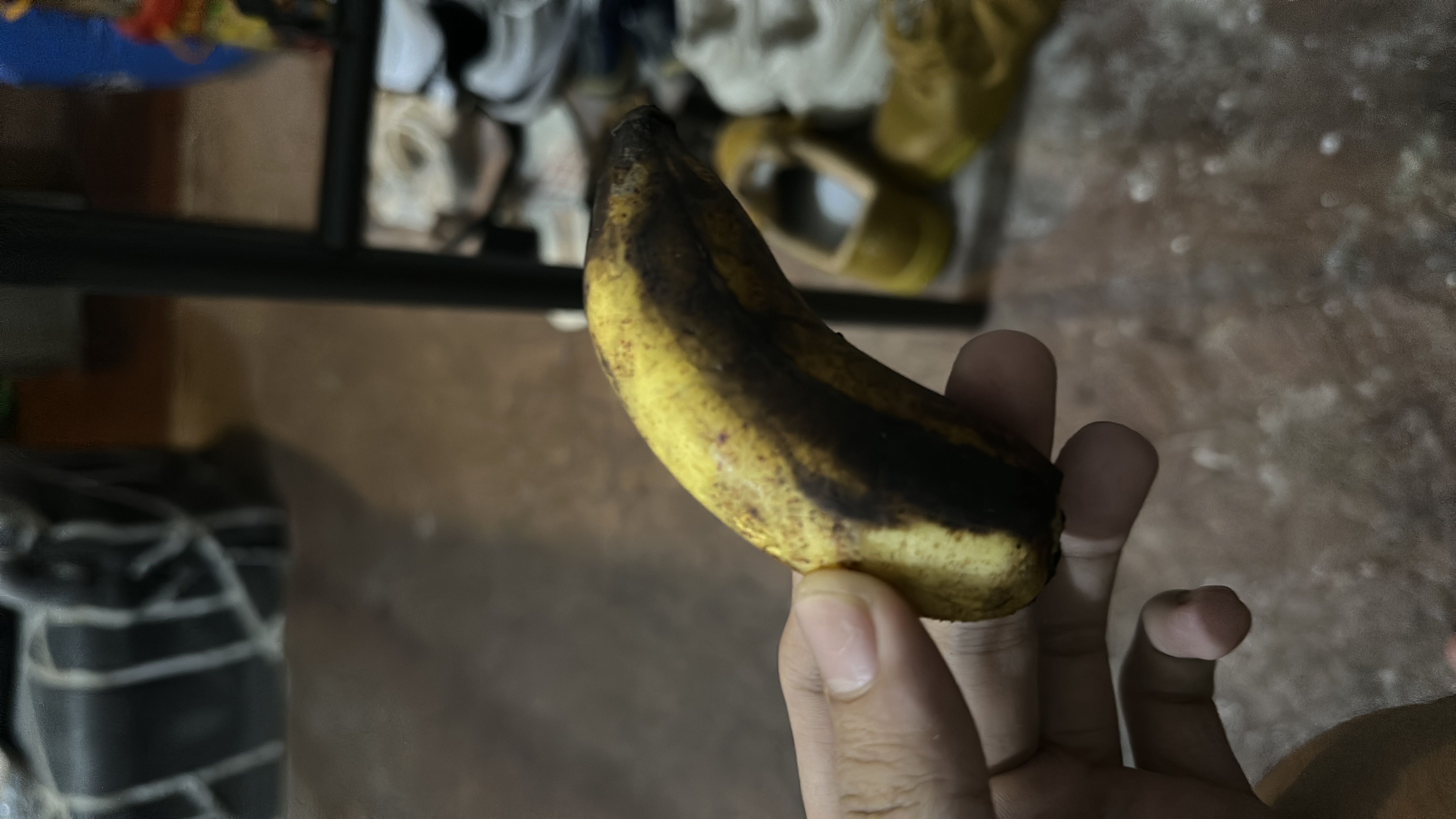 A ripe banana with dark spots, indicating high sugar content and soft texture.