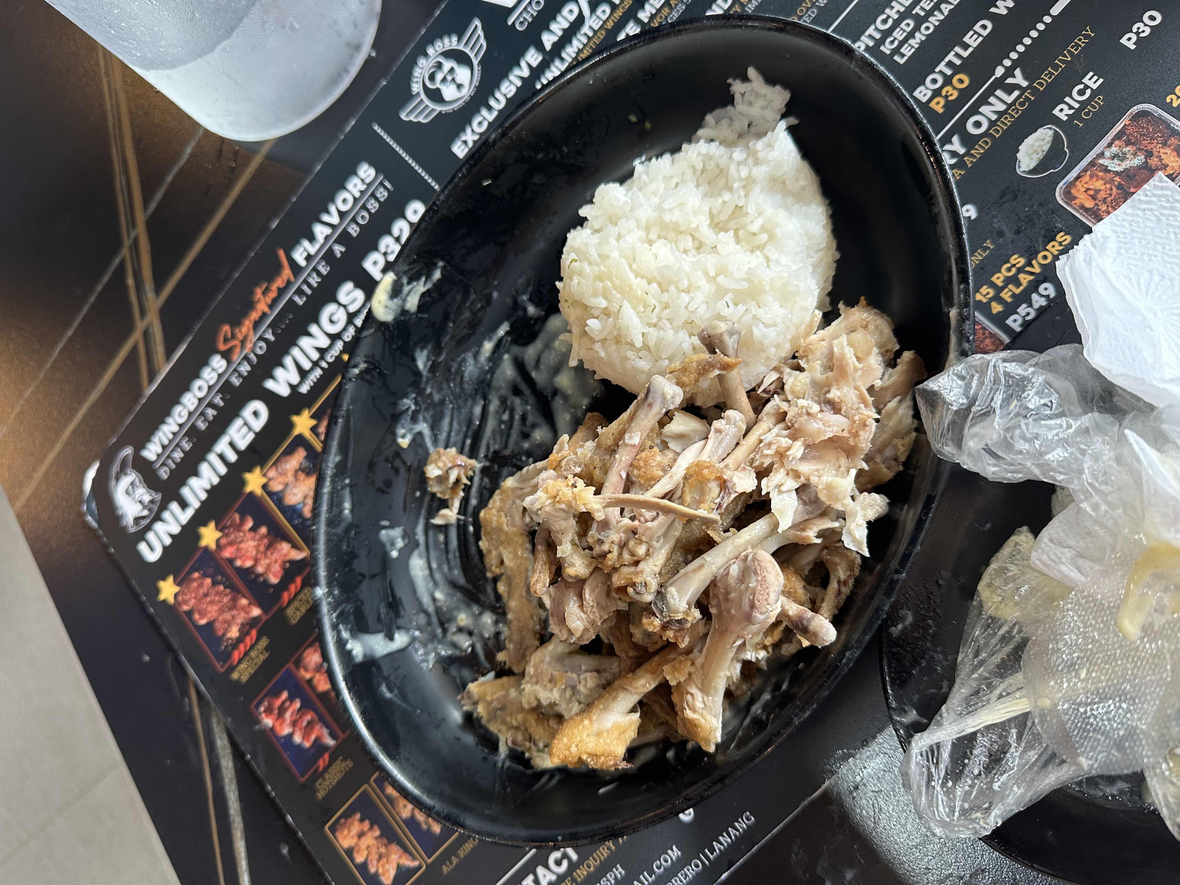 A meal consisting of fried chicken with white rice, likely high in protein and carbohydrates with moderate fat content.