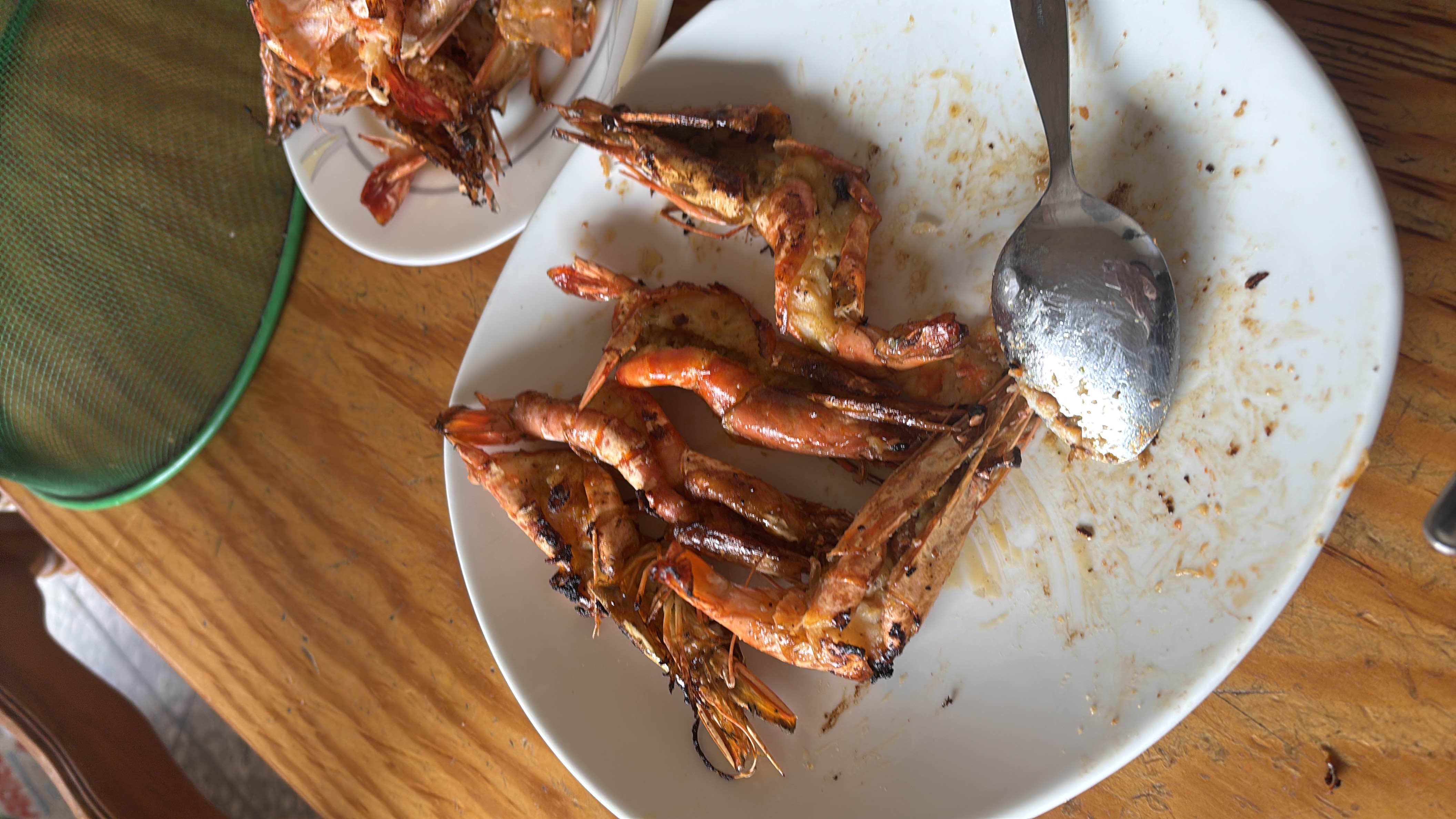 A plate of grilled shrimp, rich in protein with minimal carbohydrates and moderate fats, making it a nutritious seafood dish.