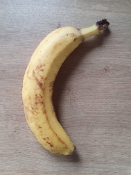 A ripe banana, rich in carbohydrates and essential nutrients, providing a quick energy boost.