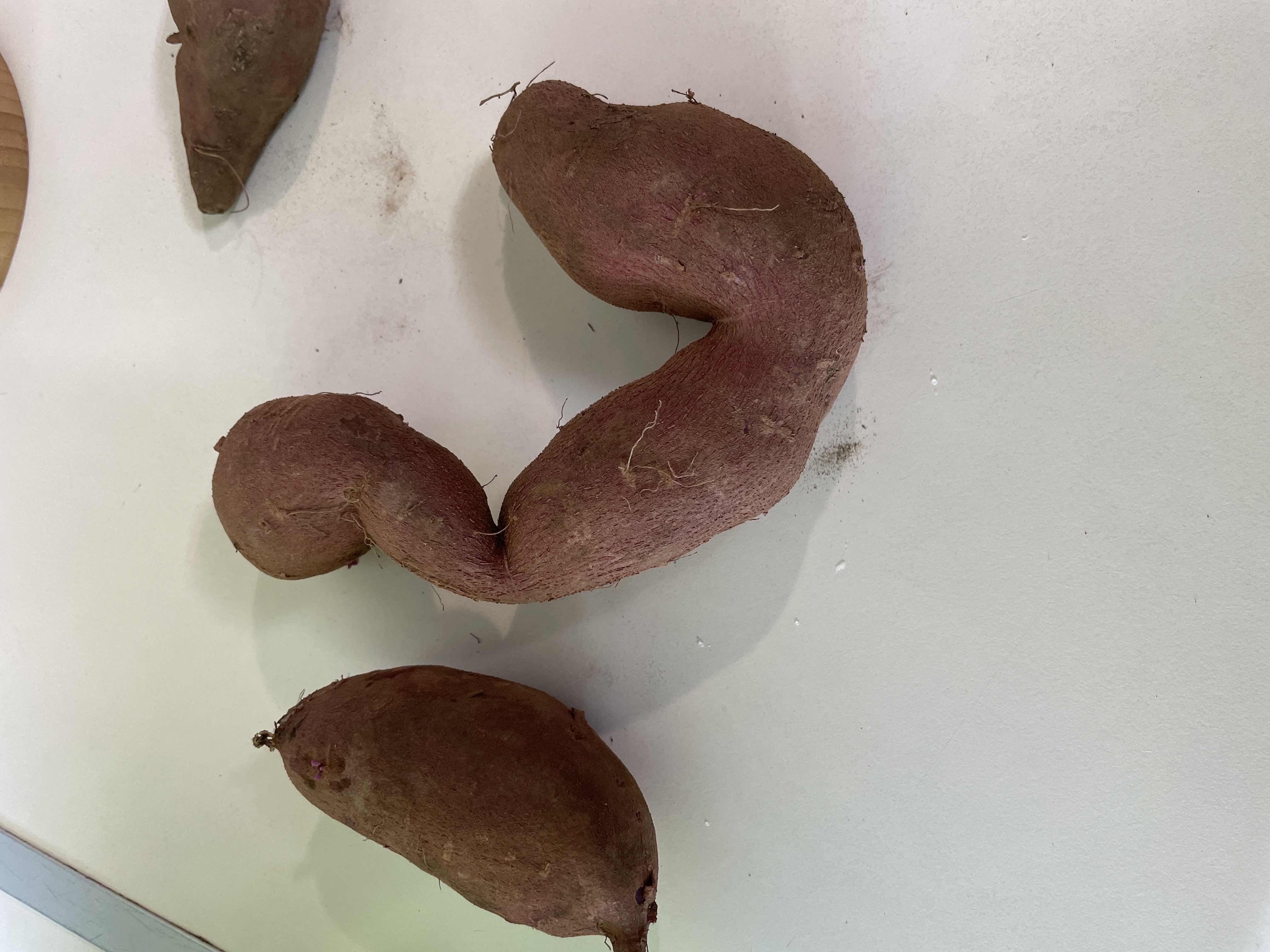 The image shows sweet potatoes, a nutritious root vegetable rich in carbohydrates and fiber, commonly used in various dishes.