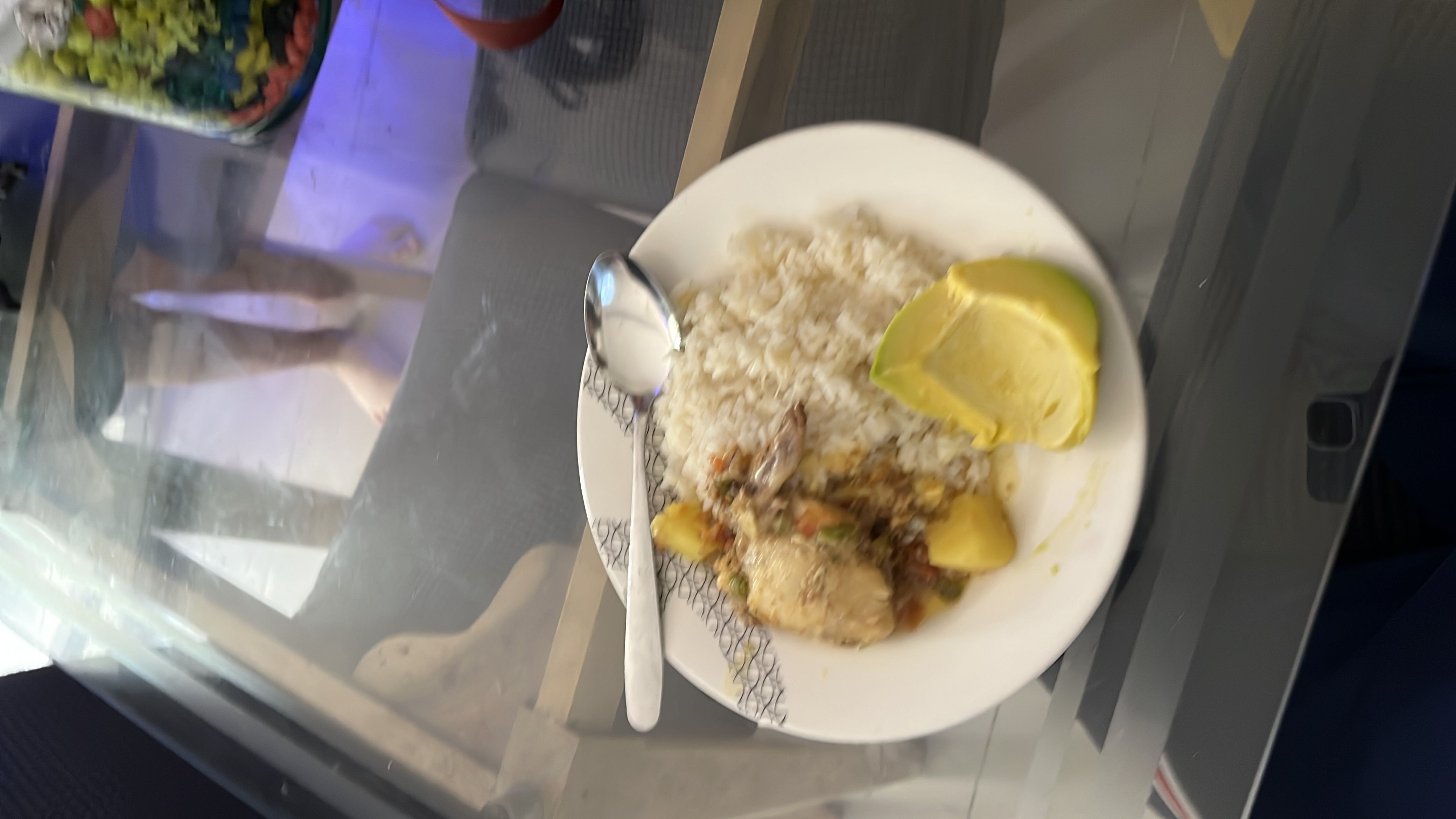 A balanced meal consisting of rice, chicken, potatoes, and avocado, providing a good mix of protein, carbohydrates, and healthy fats.