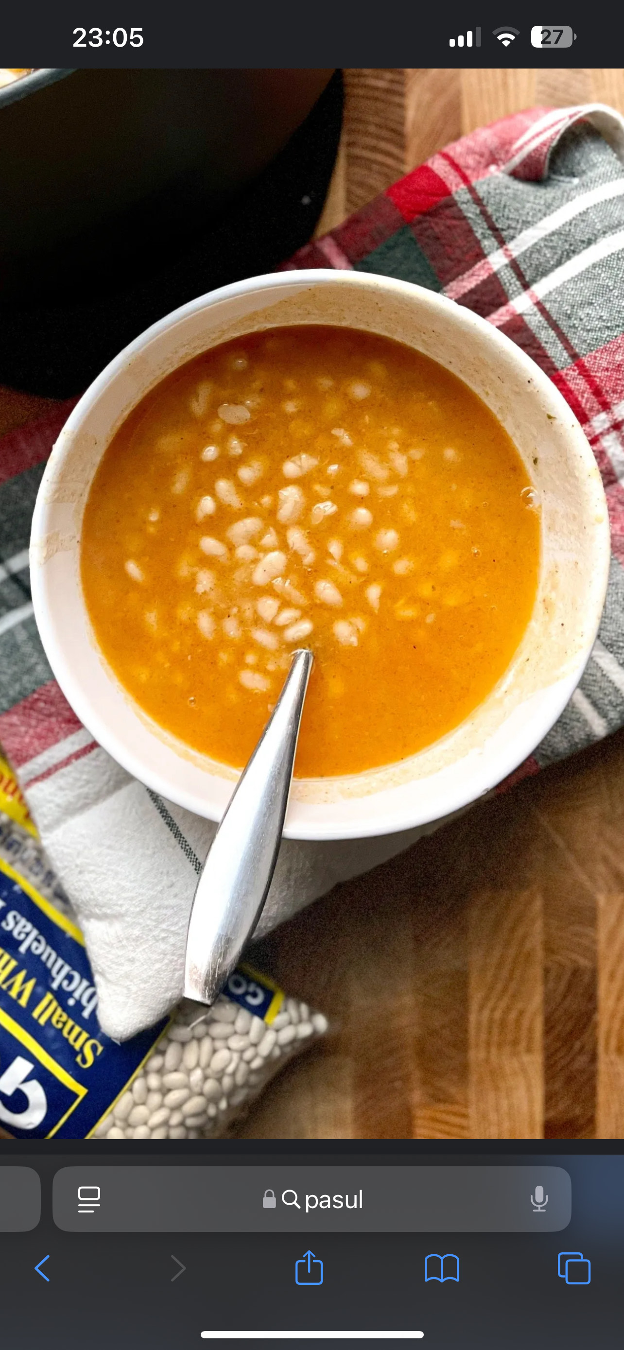 A hearty white bean soup with tomato sauce, onions, and olive oil, providing a balanced mix of protein, carbs, and healthy fats.