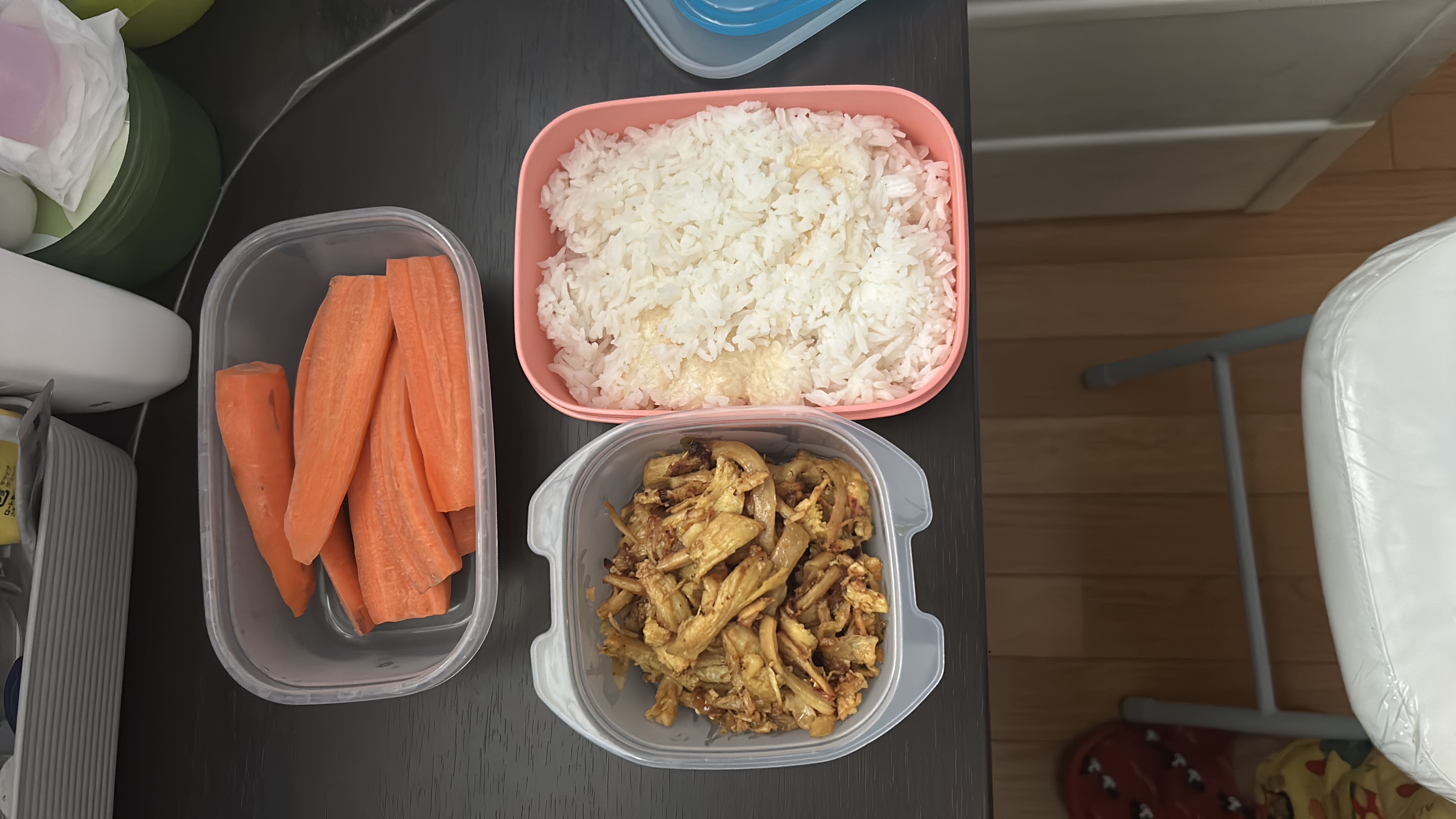 A balanced meal consisting of steamed rice, stir-fried mushrooms with eggs, and fresh carrots, providing a good mix of carbohydrates, protein, and fiber.