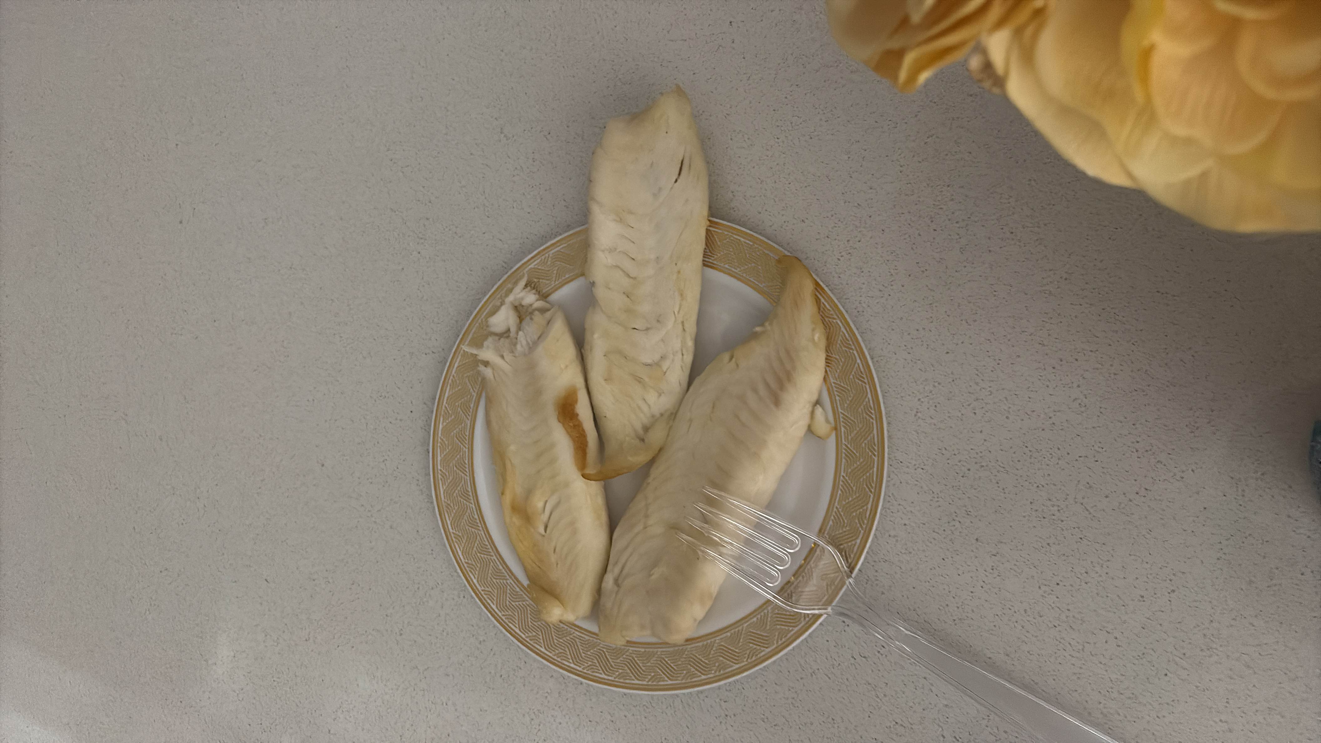 A plate with three cooked fish fillets, providing a high-protein, low-fat meal.