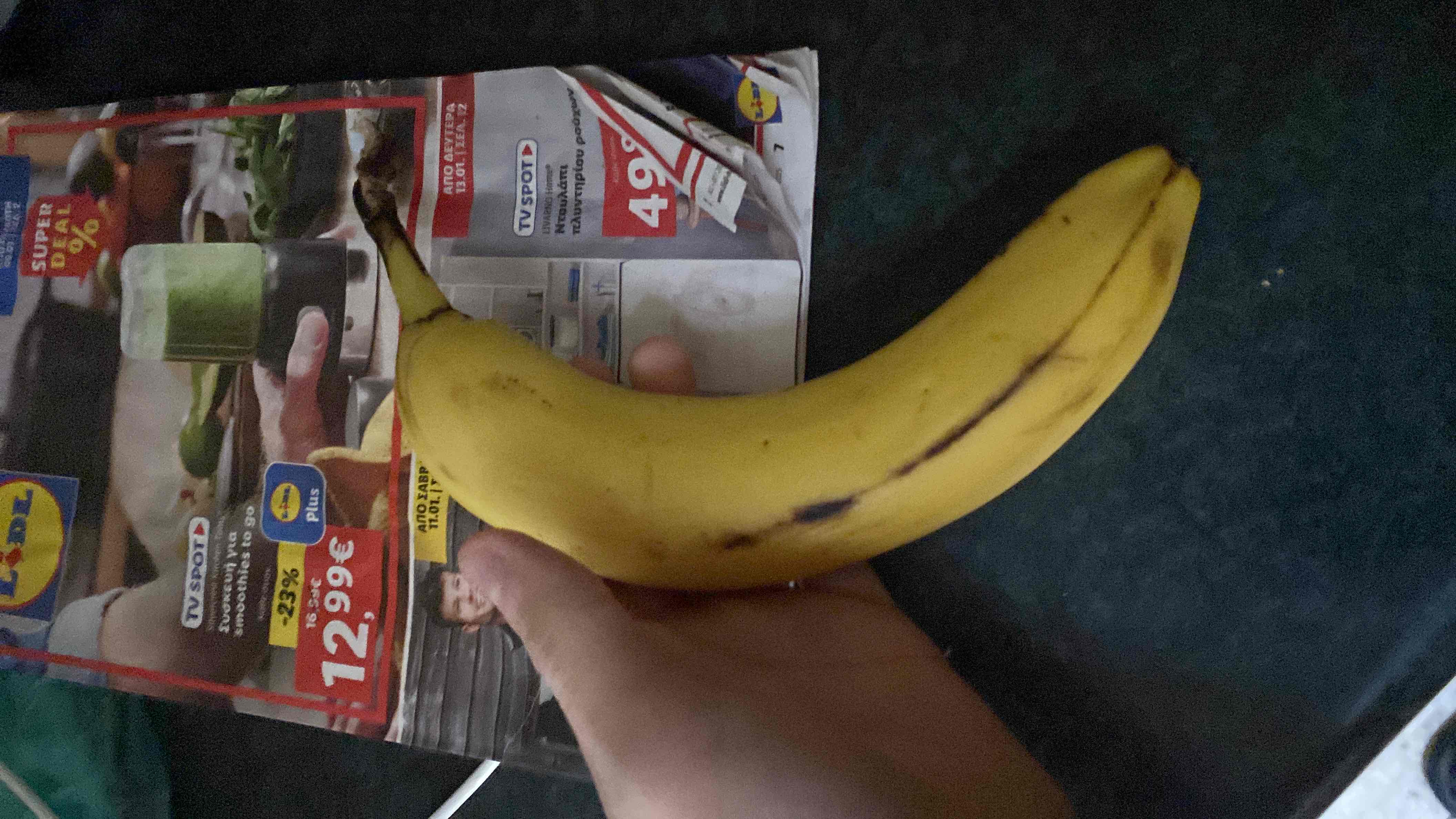 A ripe banana, a nutritious fruit rich in carbohydrates and essential vitamins, commonly consumed as a snack or used in smoothies.