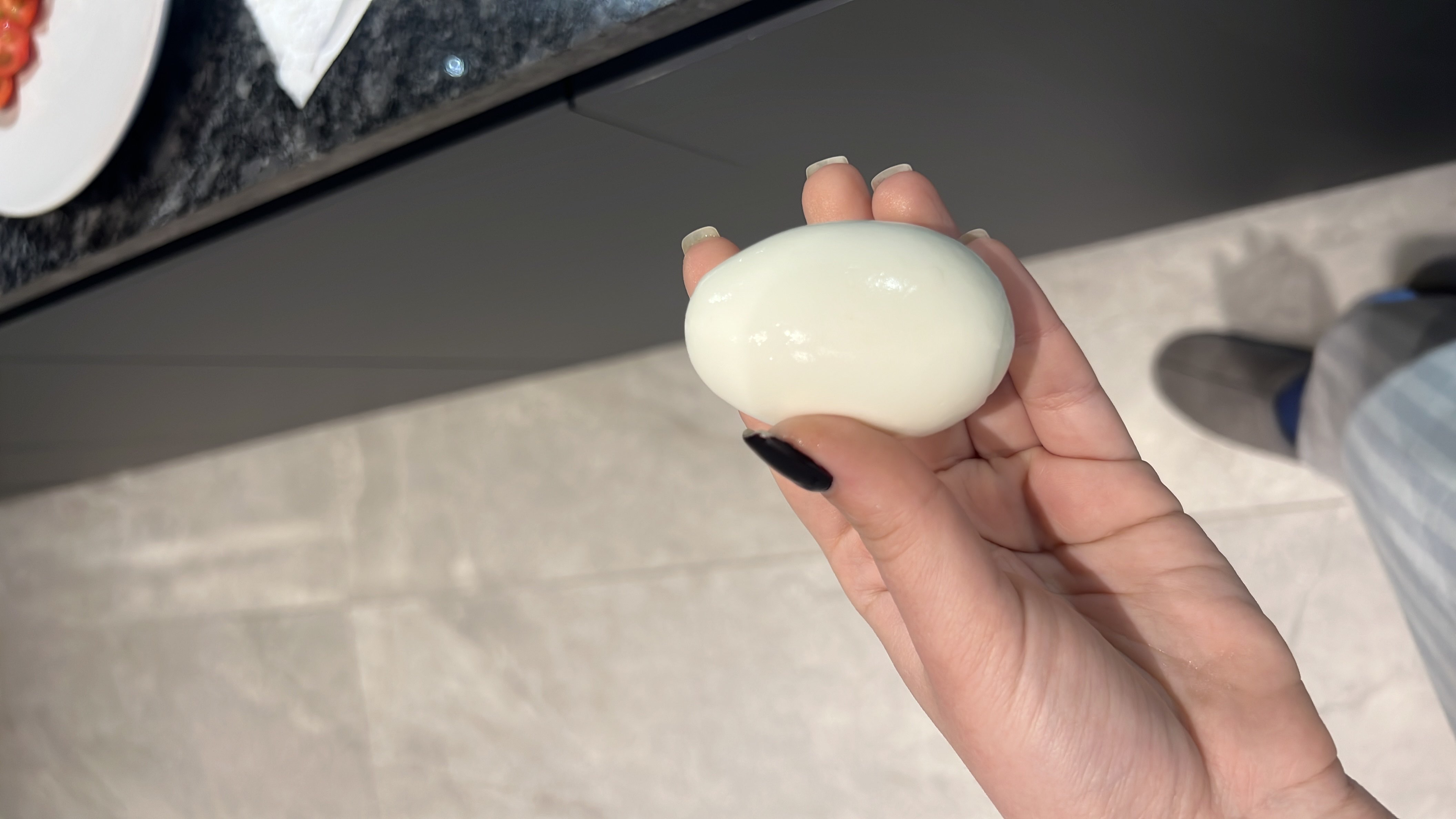 A boiled egg, a high-protein and nutrient-dense food, providing essential amino acids and healthy fats.