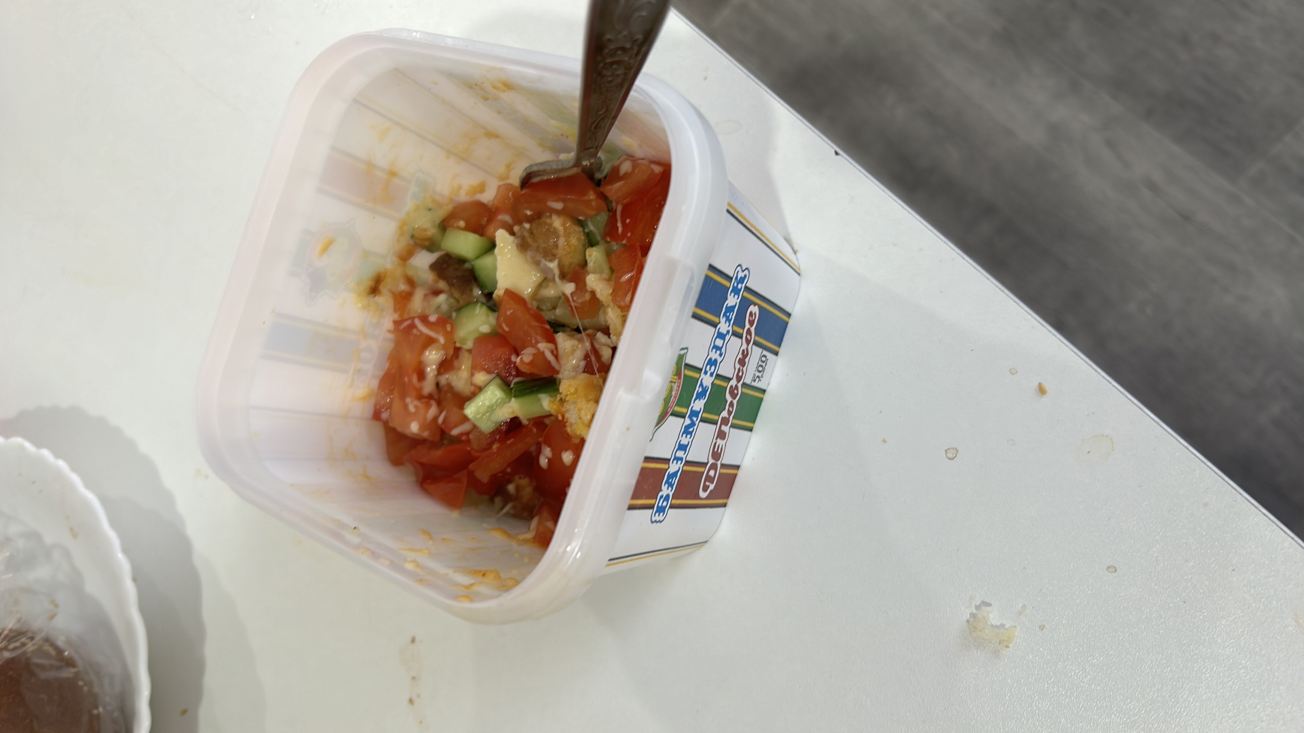 A fresh vegetable salad with tomatoes, cucumbers, cheese, and croutons, providing a balanced mix of protein, carbs, and fats.