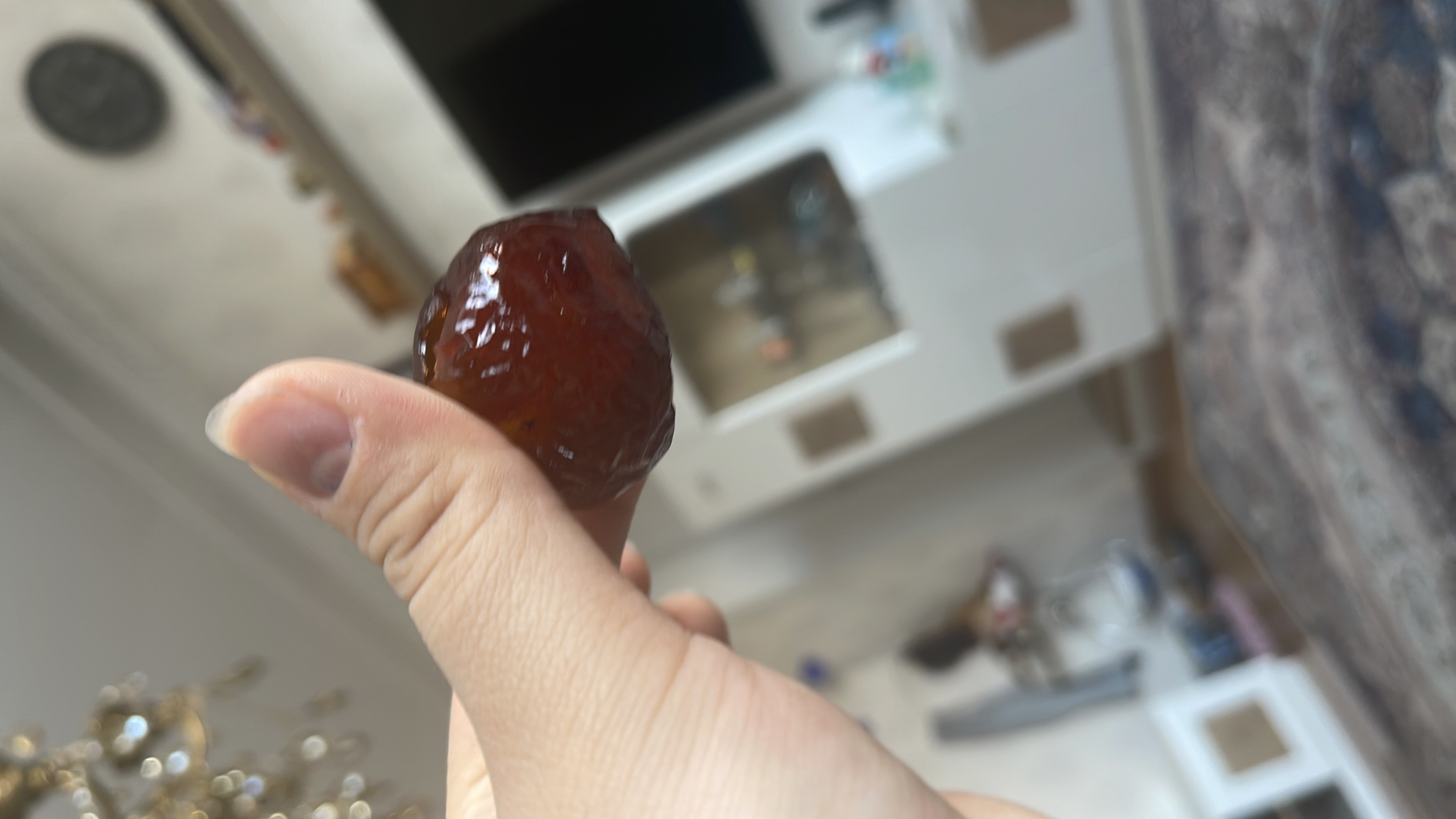 A single date, a naturally sweet fruit rich in carbohydrates and fiber, providing a quick energy boost.