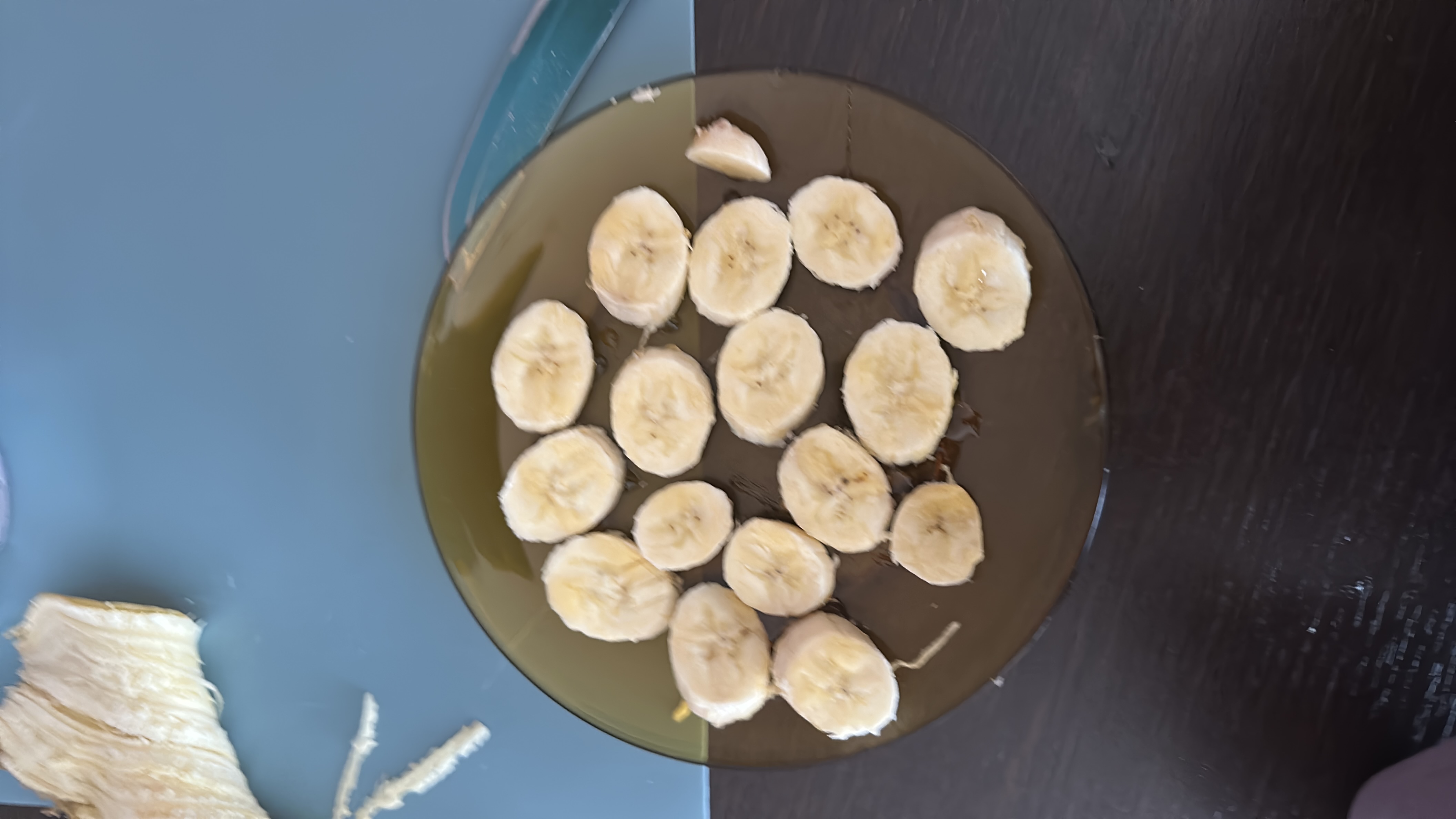 A plate of sliced bananas, which are a nutritious fruit rich in carbohydrates and fiber, providing a good source of energy.