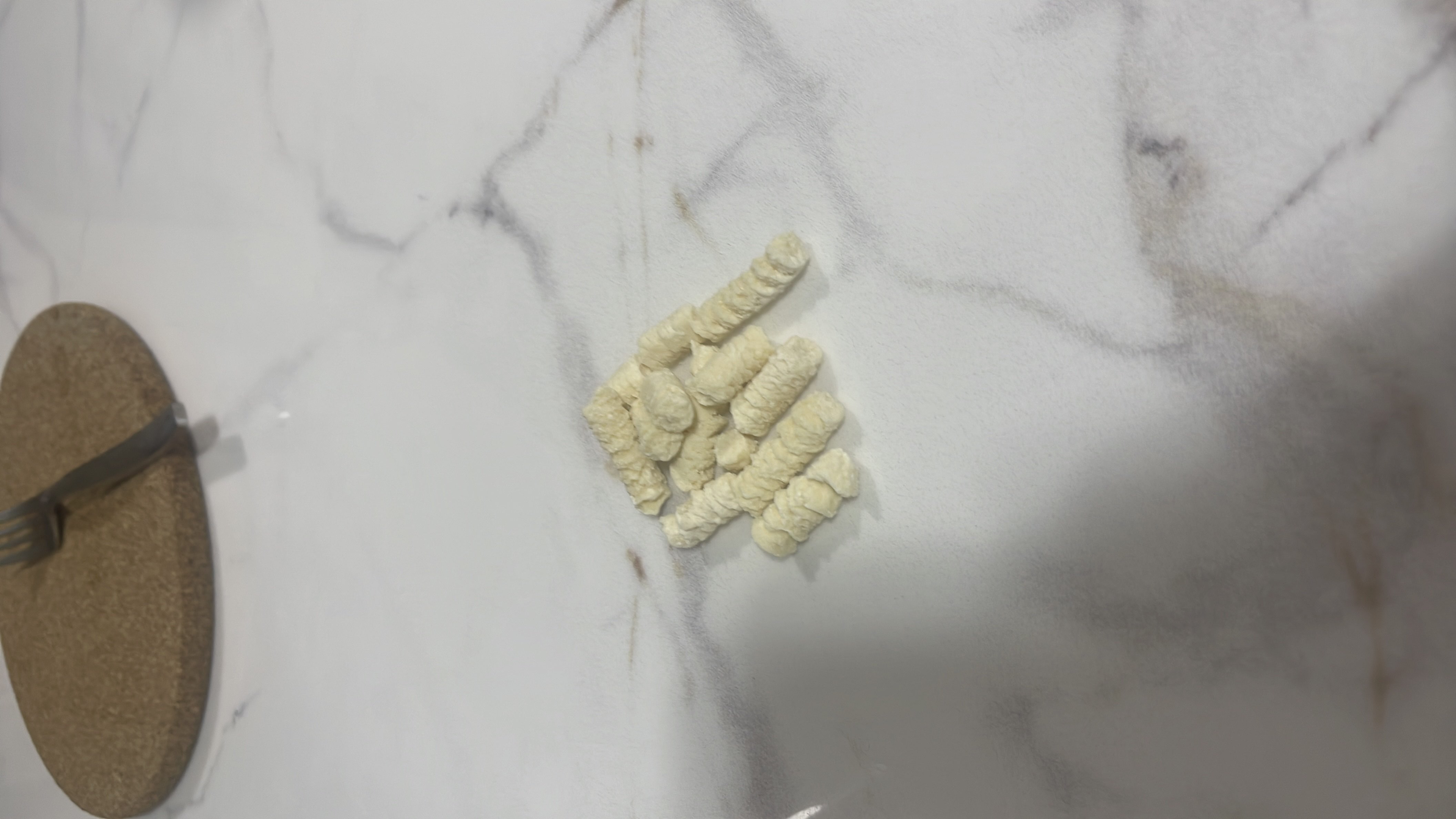 A small portion of puffed cereal, likely made from grains, providing a light and crunchy texture with moderate carbohydrates and minimal fats.