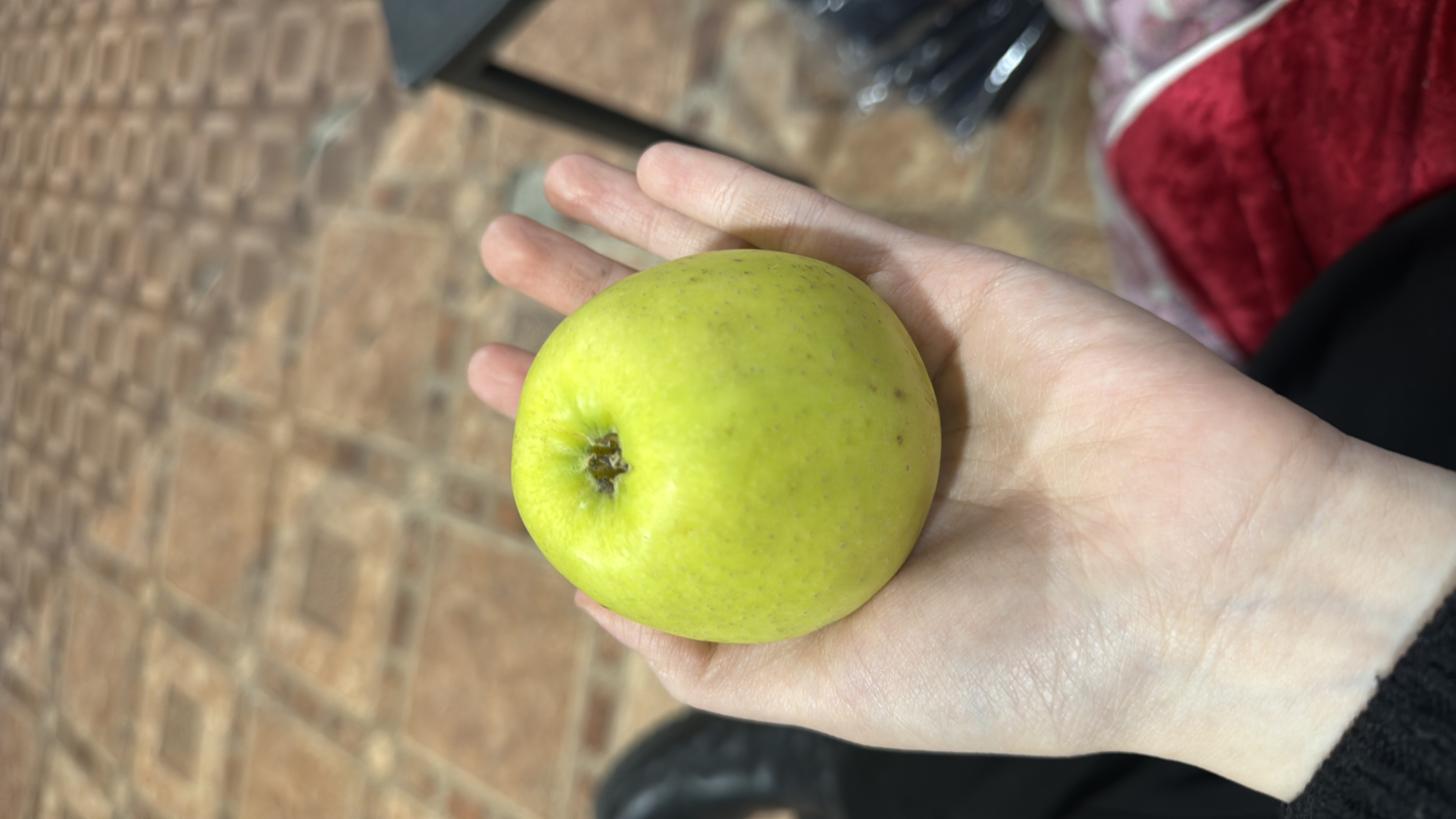 A fresh golden apple, rich in fiber and vitamins, providing a healthy and natural source of energy.