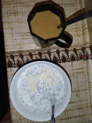 Yogurt with seeds and coffee