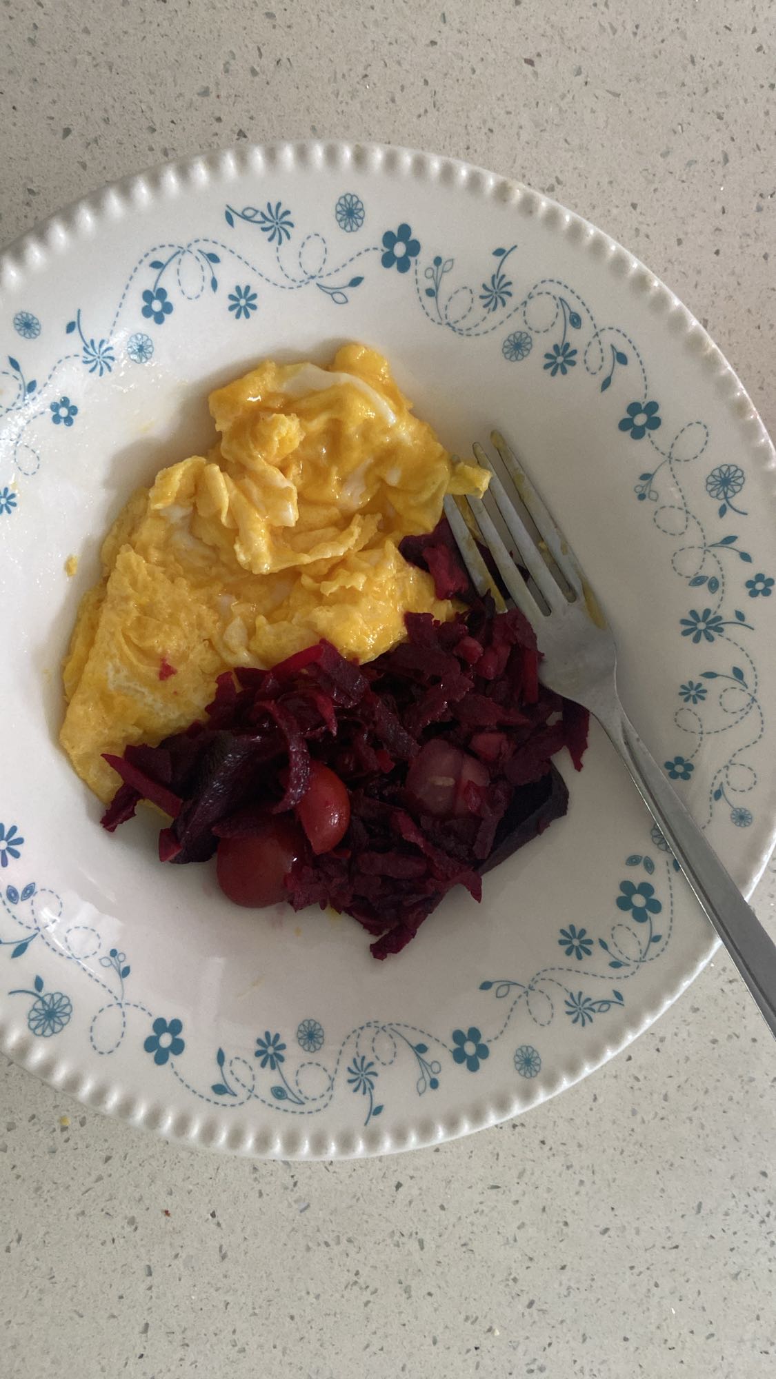 Scrambled eggs and salad