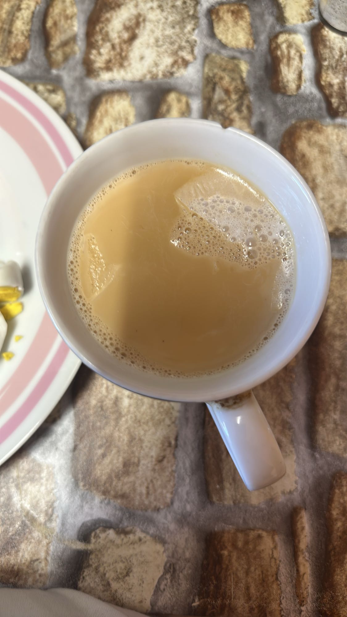 Taza de té con leche