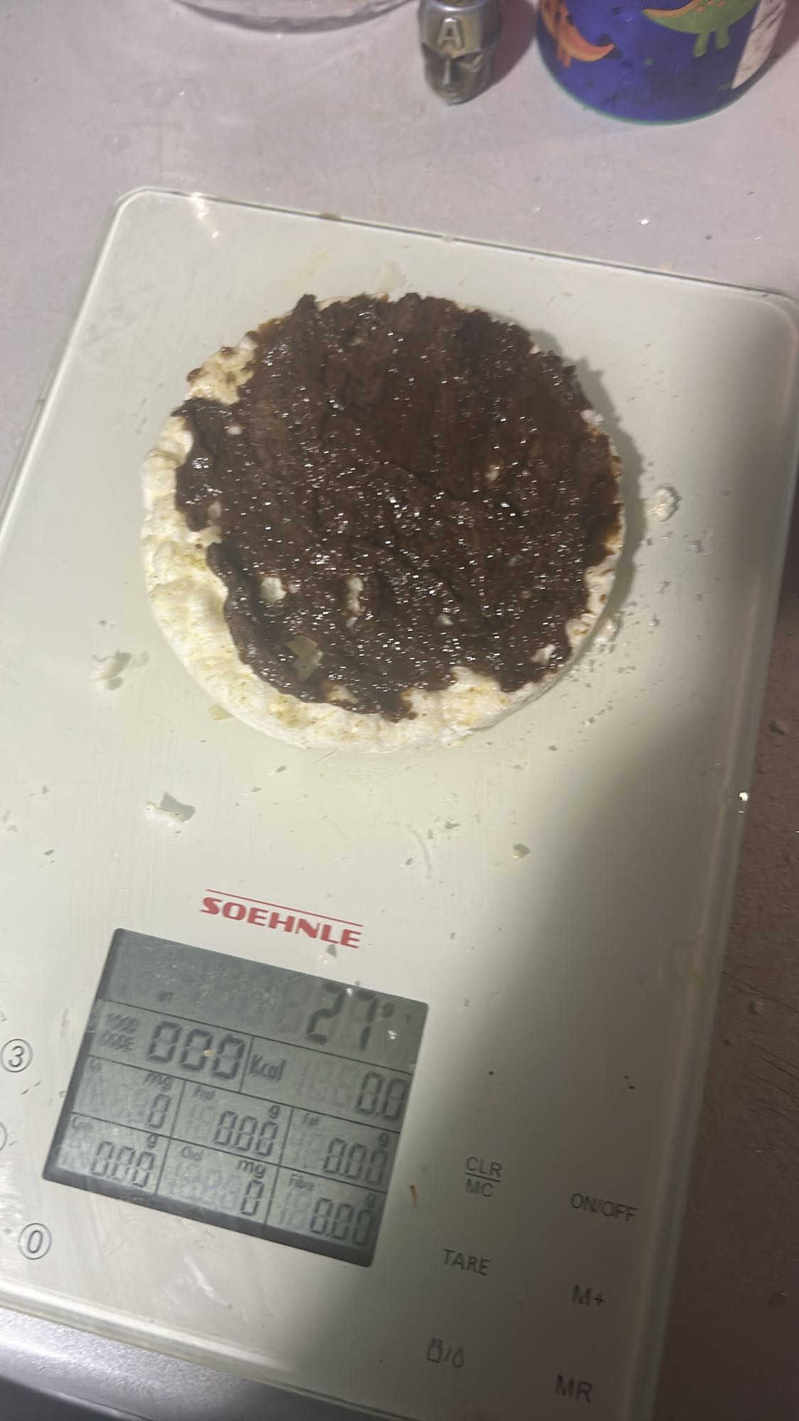 Rice cake with tahini-carob spread