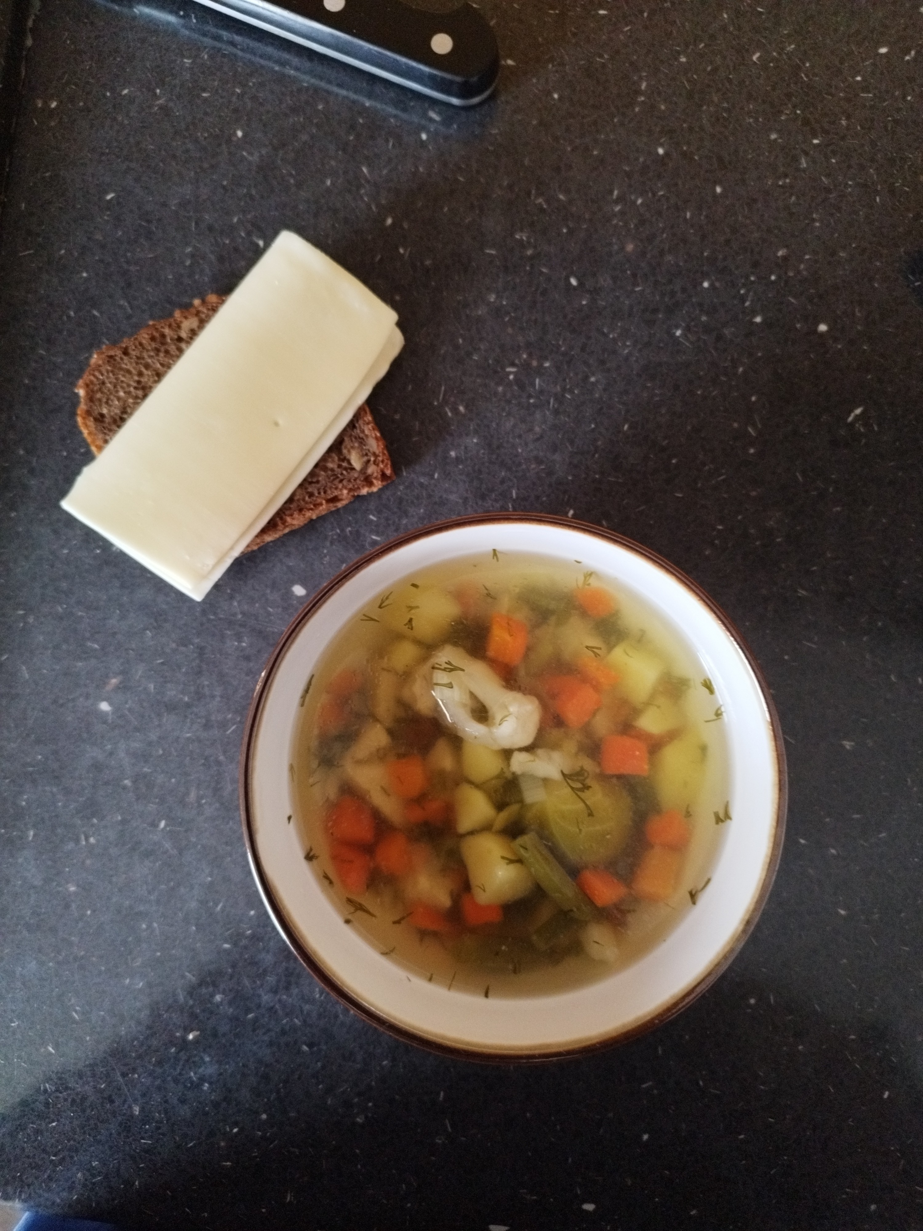 Vegetable soup with bread and cheese