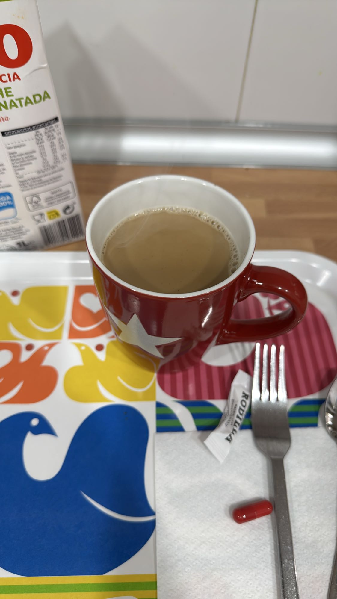 Café con leche y cápsula