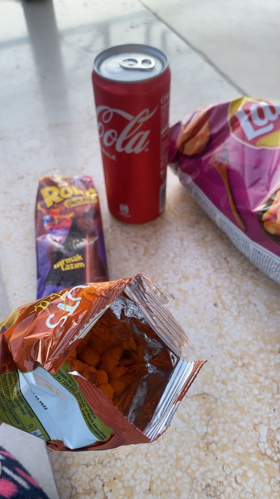 Soda, chips, chocolate snack