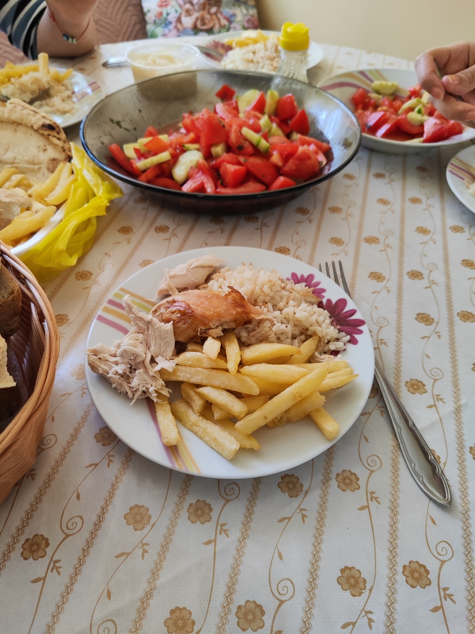 Chicken, fries, rice, salad
