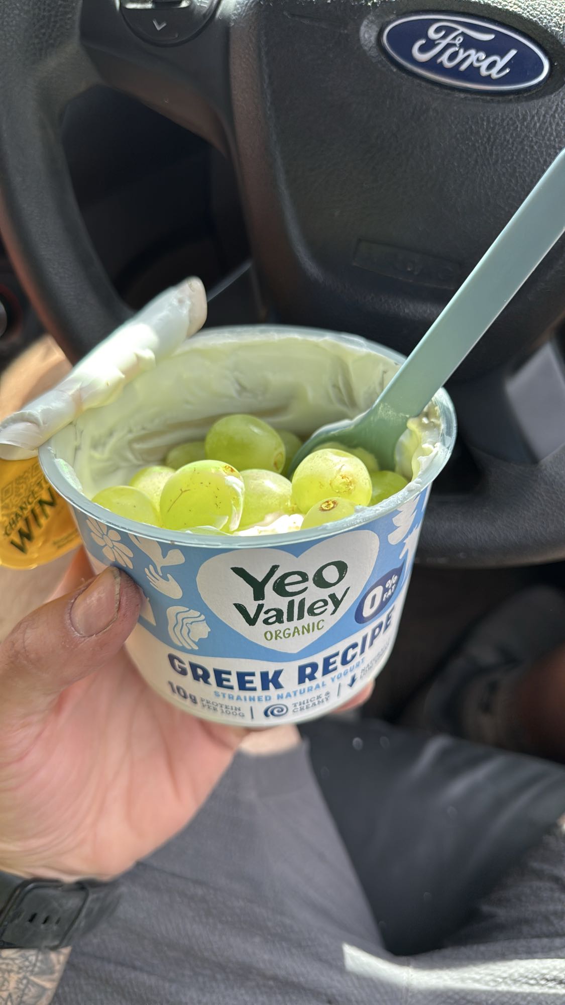 Greek yogurt with banana and green grapes